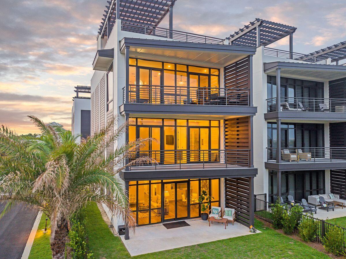 UNDER CONTRACT w 72 Hr Kickout. This nearly new contemporary home is absolutely breathtaking! Located in The Crest, one of 30a's newest luxury gated neighborhoods, you are close to it all in the relaxed Blue Mountain Beach community. Featuring custom interior selections throughout, elevator, private yard and carport and a rooftop  terrace with stunning gulf views, this home is truly one of a kind. 
The interior boasts thoughtfully curated details such as 10-ft. ceilings, stylish cabinetry and stainless Thermador appliances in the upscale chef's kitchen. A quartz breakfast bar separates the kitchen from the dining and generous open living room with an impressive built-in wet bar complete with ice maker and wine cooler.  Soft neutral coastal decor graces each of the 5  bedrooms while the bathrooms offer peace and 
tranquility with their innovative showers, sleek vanities and a luxurious soaker tub. Full-height glass doors open onto balconies on each level with garden and gulf views.

The fourth floor is the pièce de résistance with its own wet bar and refrigerator. The expansive open deck is designed for enjoying panoramic gulf views over the treetops from your lounge chair, dining table or deep-cushioned sofas. Toss steaks on the barbecue and relax beneath the shady pergola enjoying evening sunsets with family and friends.

Additionally the Crest offers amenities such as access to their private 40 x 60 heated community pool, hot tub and private cabanas! And should you want to venture out, you're a short walk from public beach access, shops and restaurants!