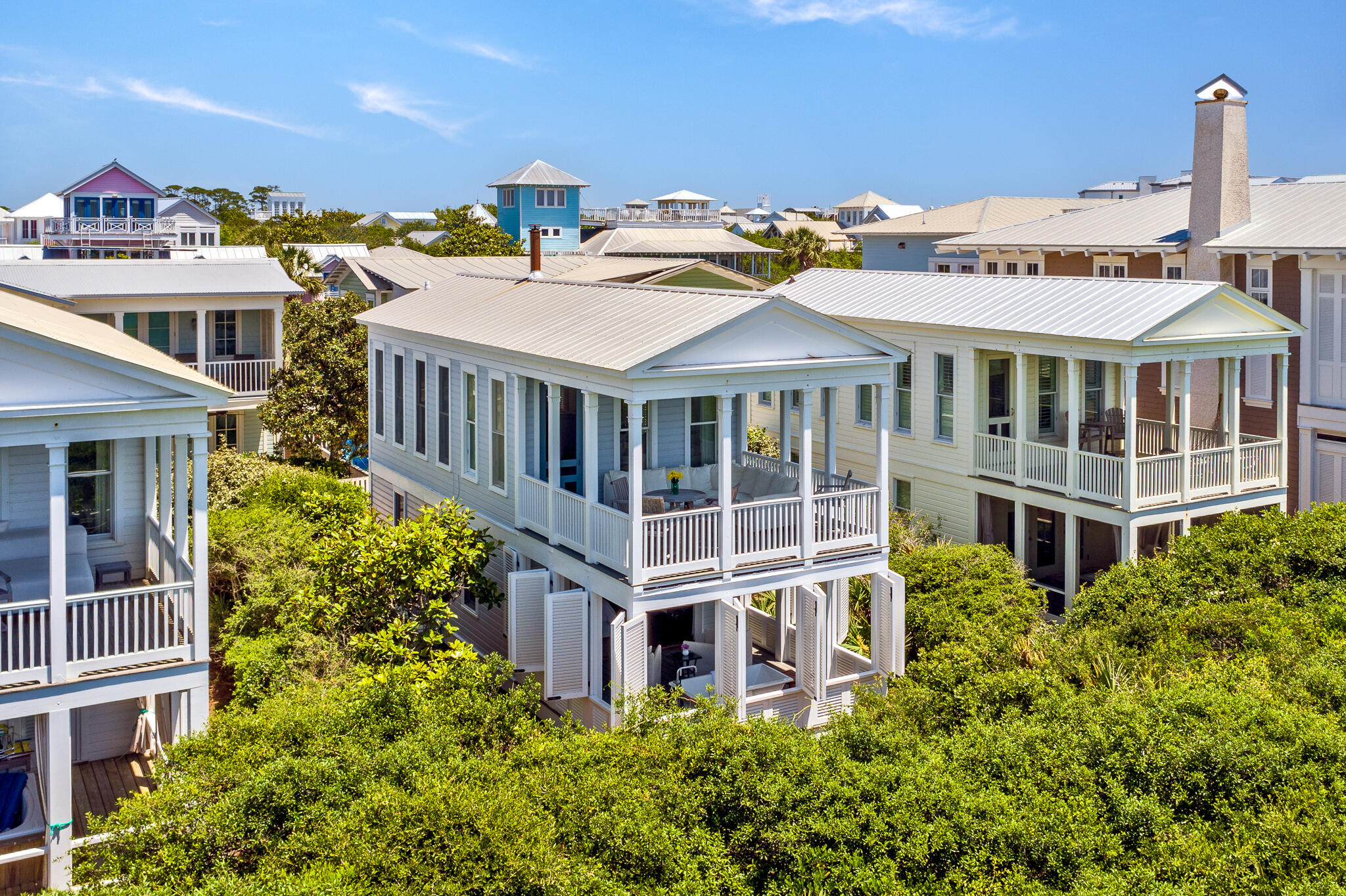 A finely crafted bungalow directly on the gulf on Seaside's western side of town. The cottage is perfection without pretension. Simplicity is its essence. The first level redesign of the bedroom and bath includes custom built in cabinets, closets,  tiled shower, washer/dryer, king bed with storage beneath.  The bedroom opens onto a private shuttered porch with an outdoor soaking tub.  Open the shutters to revel a private sanctuary of native oaks with the sound of birds singing.  The stairway winds its way up to the second level where the living room takes full advantage of the fabulous gulf views. Sunlight cascades into the cottage, constantly changing the mood of the room.  The wood burning stove adds ambience to those chilly winter nights. At high noon the turquois gulf shimmers, while later in the day the sun dips towards the horizon, waves glisten from the sunset over the sugar white sand and sea. The covered porch is the perfect place to take in the amazing views of the gulf from east to west. The full kitchen has all you need to prepare picnics for the beach or quiet dinners. The great room with vaulted ceiling and white slipped covered furnishings creates an inviting beach cottage by the sea. Meet your neighbors at the beach pavilion just around the corner for a get-together and a glass of wine or stroll down to Seaside's town center for some entertainment.