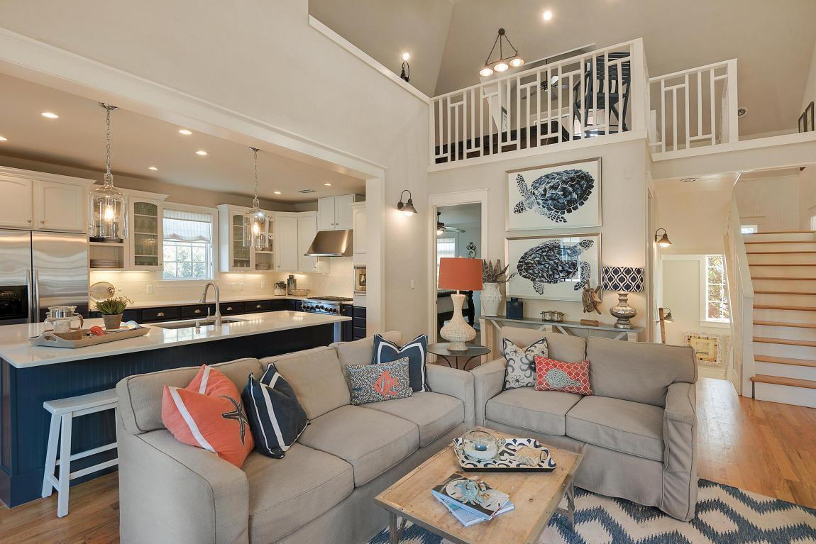 REDUCED! This is the lowest price per sq ft South of 30A in Rosemary! This Caribbean-style retreat is located south of 30A in the heart of Rosemary Beach just steps from the beach, Town Square and the coveted shops and restaurants that call this community home. In a masterstroke of architectural design, this property boasts two master bedrooms with king beds and private, en suite baths on the first level. In addition, there is a bunkroom with two sets of bunks, perfect for 4 children. Once upstairs, the spacious kitchen brings together professional appliances, granite countertops, and an eat-in bar that overlooks the great room and has seating and room for all to gather after a long day on the beach. This level features a third master bedroom with another king-size bed and private bath. Overlooking the large living room is an expansive loft and recreation room which holds a pool table, TV, and full wet bar. There are two extra single beds and a full bath, which makes this room great for teenagers. Large porches accessible from the living room and loft help bring the outside in, a great setting for relaxing, reading and outdoor dining.
The carriage house sits above the two-car garage and features a balcony, affording great views of Rosemary Beach. Entering the carriage house you find a cozy living area complete with a full kitchen, sofa and bar seating for two at the island. This cozy carriage house features a large bedroom and bathroom with glass-enclosed shower.
In your private courtyard you will find an outdoor shower and well equipped summer kitchen. Tthis courtyard has been approved per the POA for pool.  This property represents an excellent value and opportunity to be a homeowner in one of the most cherished areas of 30A while returning fantastic returns. All measurements and dimensions are estimates and buyer should verify that which they deem important.  Sold AS IS,  fully furnished and rental ready.