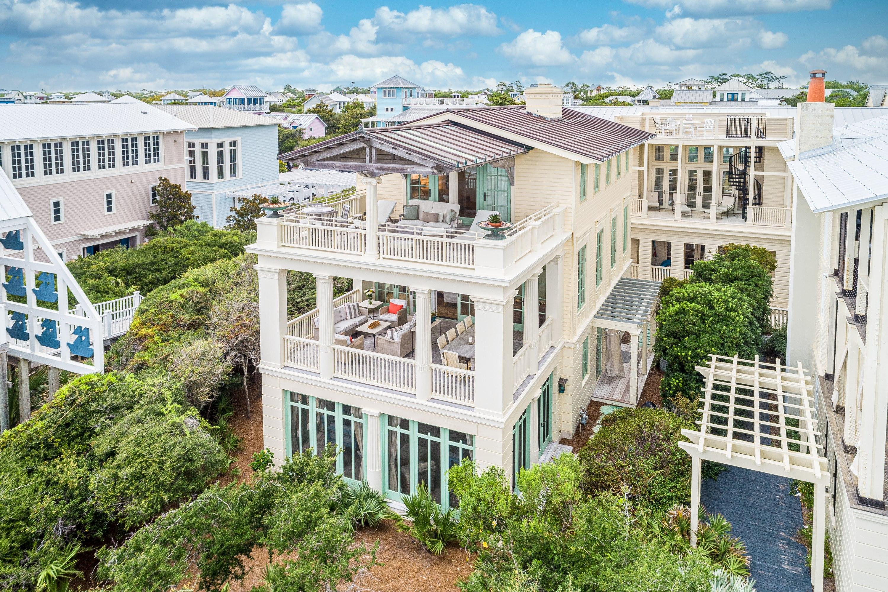 This exclusive residence has been the cover story for several publications including Architectural Digest, Coastal Living, The Coastal Cottage, 30A Style and more. Featured on Oprah.com as one of the 7 Prettiest Summer Porches (2017). ''Everything about this privately owned cottage emotes a singular impression...Style. There are front porches on all three levels with the view more encompassing than the one below. These amazing views of the gulf compliment the generous living spaces and four bedrooms, three on the first floor and the master suite on the third level. The first floor's expansive porch features two sumptuous bed swings with plenty of seating to relax and listen to the gulf breezes. On the second floor the house opens up and outward from the kitchen, dining and living areas in grand sequential order. Views of the Gulf take center stage without a doubt. The distinctions between indoors and outdoors merge and lines of the architecture melt away.  The third floor is devoted to the stunning master suite, with a deliberately open and out-there with nature design.  On the porch, an articulated truss offers shading and justification of the home's piece de resistance, the single Ionic column. This home reflects all the touches and traditions of coastal life with the best of attention given to every detail. Narnia's obvious bravado is neither daunting nor imposing. It is engaging and inviting thanks to its comfortable scale, exacting proportions and a romantic marriage of vernacular coastal architecture and 1930's Swedish Classicism."  Coquina stone pavers surround the exterior first level and also used as flooring inside the foyer hall. The entire home is handcrafted of wood like a piece of fine furniture. Reclaimed wide plank pine flooring was used in the living areas and master suite.  Coffered bead-board ceilings, board-and-batten and nearly 100 different custom made moldings can be found throughout the house. Additional amenities include elevator, fireplace, pantry outdoor shower, heated/cooled basement, closed loop geothermal system, custom made windows and doors, Creston AV and lighting system, 2 car carport. While believed to be true and accurate buyer to verify all dimensions and information.