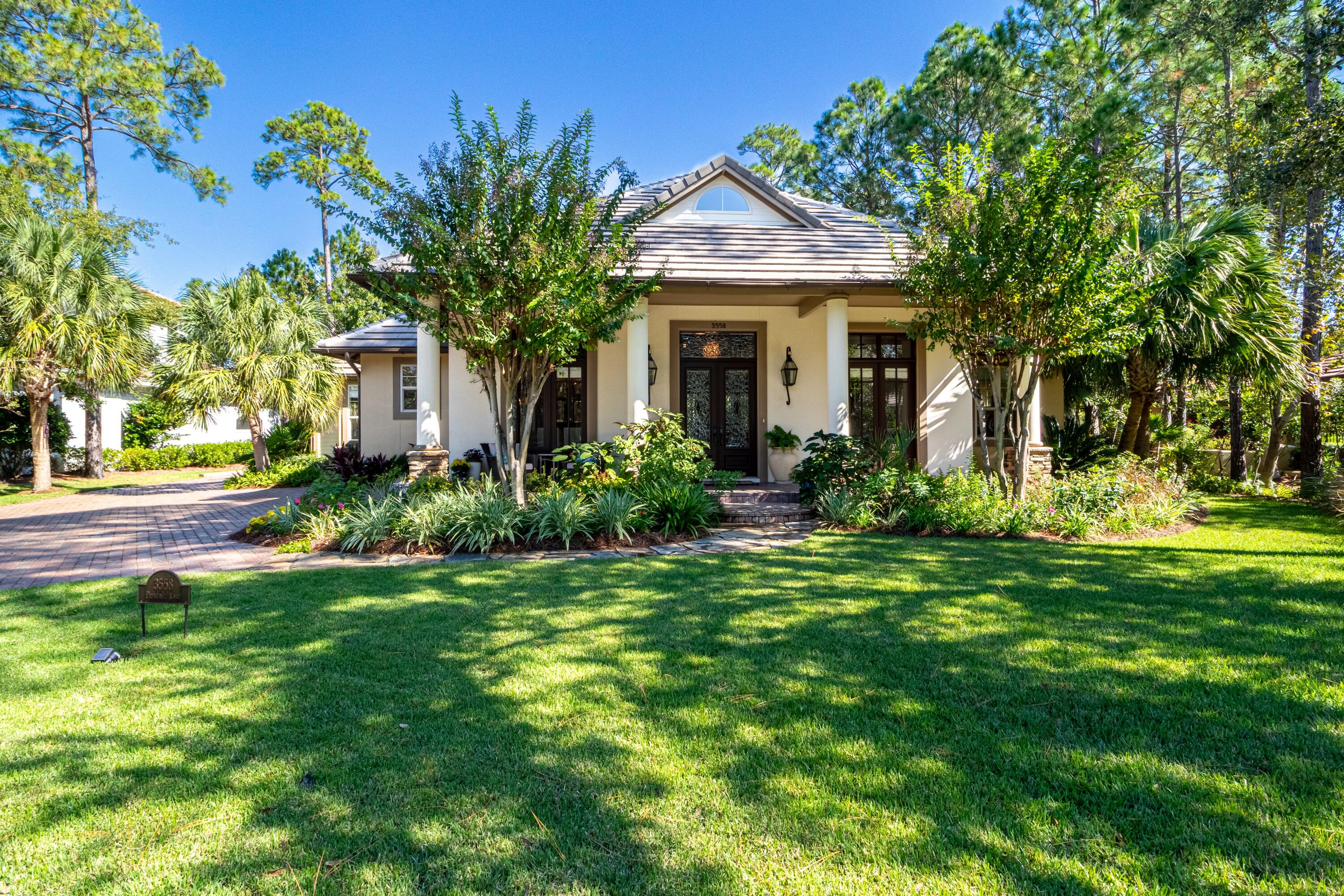 Tucked away in the exclusive Preserve neighborhood within Burnt Pine at Sandestin Golf & Beach Resort, 3558 Preserve Lane offers refined, single-level living with exceptional indoor and outdoor spaces. Soaring 25-foot ceilings in the great room create an airy, grand feel, while the newly painted interior and all-new flooring—including rich hardwoods throughout the main living areas—bring a fresh, elegant touch.
The main home flows seamlessly into the backyard oasis, featuring a private pool, an outdoor kitchen, and plenty of covered space for relaxing or entertaining. Perfect for guests or extended family, the spacious one-bedroom carriage house sits above a 2.5-car garage (room for two vehicles plus a golf cart) and includes its own full kitchen and living room. With two brand-new HVAC systems in the main house and an unbeatable location just around the corner from the private Burnt Pine Golf Club, this home blends comfort, quality, and convenience in one of the most sought-after enclaves in Sandestin.

As an introduction to the Sandestin lifestyle, we invite our new owners to explore amenities that make Sandestin special. The listing brokerage and seller(s) are presenting the buyer(s) of this property with (2) 90-minute rounds of Tennis court time, a golf foursome at one of our three championship courses, and a round of golf for up to four (4) players at the unrivaled Burnt Pine Golf Club.

Sandestin Golf and Beach Resort features more than seven miles of beaches and pristine bay front, four championship golf courses, 15 world-class tennis courts, a 226-slip marina, a fitness center, spa and celebrity chef dining. Shop, dine and play at the charming pedestrian village, The Village of Baytowne Wharf and more. Inside the gates of the resort, residents enjoy a balanced lifestyle of high-class living, spanning the 2,400 acres from the beach to the bay. Everything within the gates of the resort is accessible by golf cart or bicycle. The entire resort is interconnected by miles of pedestrian, bike and golf cart paths that weave through groves of live oaks, meandering past natural lagoons, fountains, man-made lakes, and meticulously landscaped fairways.