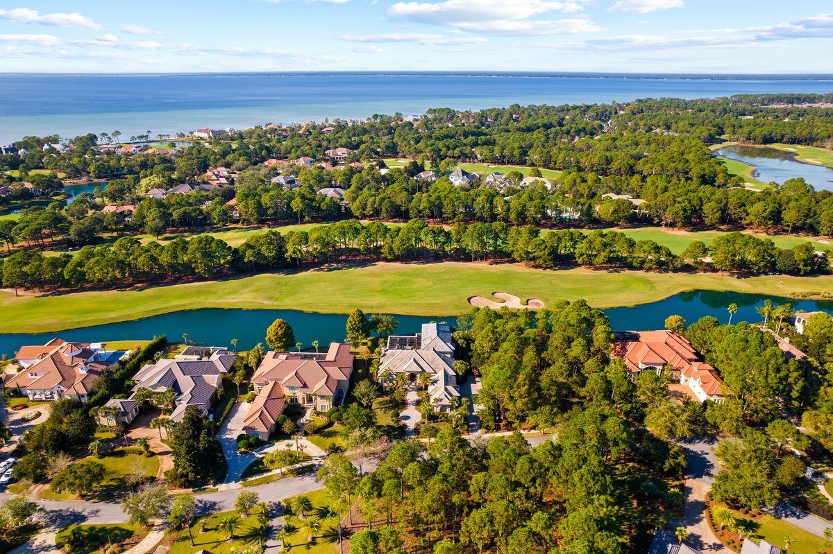 This spectacular estate is located in the exclusive community of Burnt Pine in the Sandestin Golf and Beach Resort. Enjoy your stunning lake and golf course views in this meticulously maintained home. A well-planned layout provides everything you need for daily living on the main level and includes a three-car garage and additional golf cart garage. This home has an amazing second-level screened patio, bonus entertaining room and bedroom suite perfect for extended family or guests complete with private elevator. The master suite takes up the left wing of the home and is complete with his/her walk-in closets, separate shower and tub and a cozy sitting room off the bedroom. The main level has an office, formal dining room, living room with fireplace and a family room off the open kitchen. You will enjoy the gorgeous walk-in wine cellar next to the kitchen. The laundry room has a dog wash and stairs up to attic storage above the garage. There are two guest bedrooms on the main level each with private bathrooms. The screened pool, lanai and grilling area are what Florida living is all about. There is plenty of space to lounge and sun around the pool and hot tub. The Raven Golf Course's 11th hole runs behind the home, so everyone will enjoy the lake and golf course views while taking in the warm Florida weather. The covered dining and grilling area have it all - TV, counterspace and cabinets, and a new stainless, built-in grill. 
Sandestin Golf and Beach Resort features more than seven miles of beaches & pristine bay front, four championship golf courses, 15 world-class tennis courts, a 226-slip marina, a fitness center, and spa & celebrity chef dining.