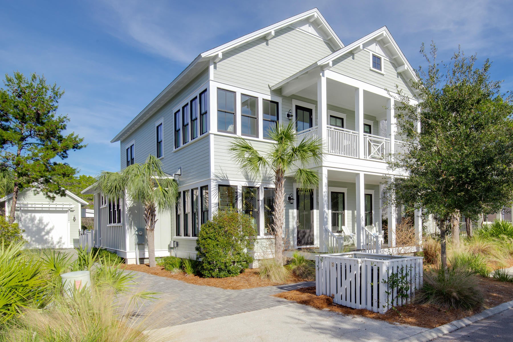 Amazing Sunlit beach home in WaterSound Beach. This custom designed home completed in 2014 offers craftsmanship features and designer furniture that rival any home in the area. From the moment you enter this home, you will notice custom trim and finishes throughout. Skillful mill-work, custom molding, doors and cabinetry are all displayed with tons of natural light from the plethora of windows throughout. The open floor plan flows seamlessly between the over sized kitchen and the great room with tabby fireplace, all leading out to the screened porch and your own private oasis in the back yard with heated pool and waterfall, fire pit, summer kitchen and outdoor dining. Perfect for large gatherings, family dinner or a quaint evening. The over sized master bedroom features tons of natural light, covered deck over-looking the pool and backyard and luxe master bathroom with modern soaking tub, glass-enclosed spa shower, and custom makeup vanity. The 3 additional bedrooms all feature on-suite bathrooms with one bedroom on the main level. Additional features include shiplap siding, distressed wood beams, built in book shelves, tabby fireplace with picky cypress mantel and natural gas, custom hardwood floors, barn doors, Carrara marble counter throughout, 600 + sq feet of covered deck spaces and more. A truly must-see home!