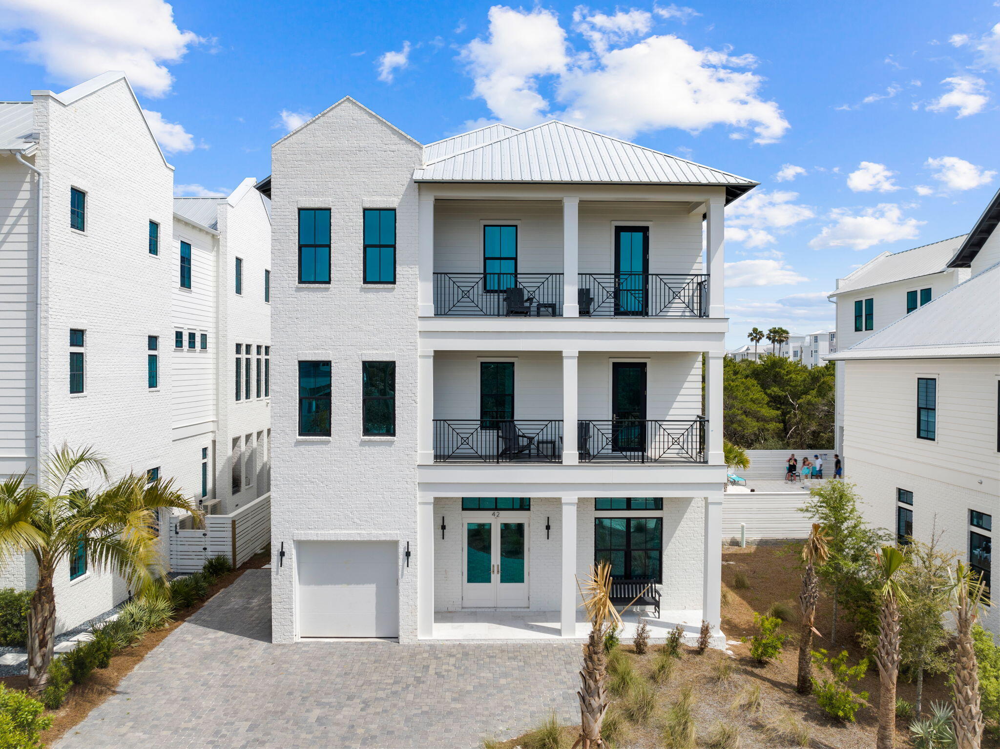 Primely positioned and beautifully designed, this sleek beachside retreat features sweeping gulf views and masterful new construction in the newly developed Seven Palms at Inlet Beach. This impressive home offers a stunning vertical elevation with white-washed parapet walls and striking architectural elements including a fourth story lookout deck. Notably featuring 7 bedrooms and 7.5 baths and 5,485 sqft of living space, this property is an idealistic second home, short term rental investment or primary with exceptional comforts such as a private elevator, resort style pool and spa with a massive rear pool deck and fenced privacy, summer kitchen and four levels of porch space to soak in the endless gulf views and sunset vistas. Target completion on this property is by end of the year and will be the perfect escape for the summer season. Other notable features include an open floorplan with an expansive living room, kitchen and dining area with beautiful views over the adjacent resort style amenities including a covered outdoor kitchen, private pool and spa as well as garage parking and outdoor shower. The primary suite on the third level features Gulf views and direct access to the south east facing covered deck which has an ascending staircase to soak in the panoramic views from the fourth floor tower. This property is located in the heart of Inlet Beach, Florida adjacent to Rosemary Beach and the east end of 30A as well as close to ECP Northwest Florida Airport as well as all of the world class shopping, dining and entertainment that South Walton County is known for.