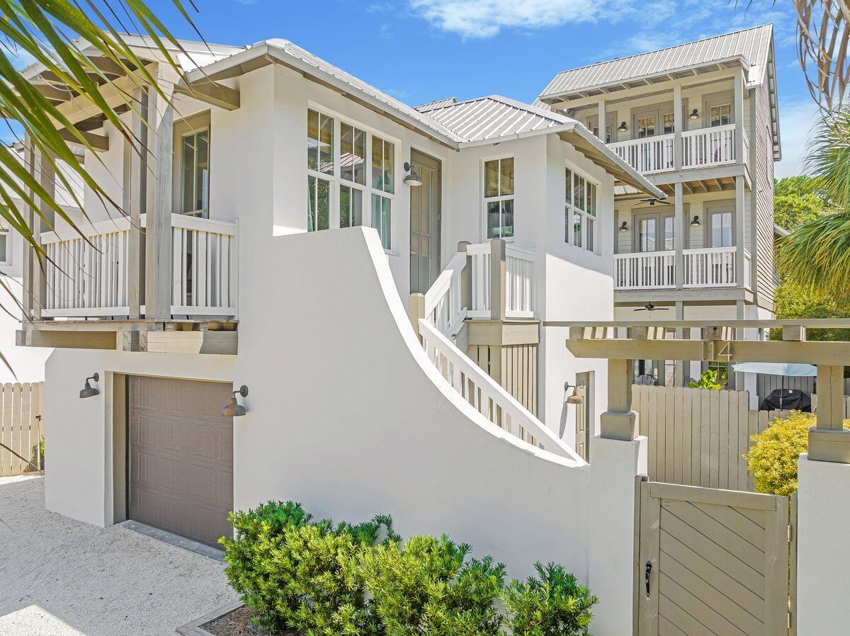 You'll love being within walking distance of the beach, shopping, dining and numerous activities from this five-bed, five-and-a-half-bath home in Costa Carina, a quiet neighborhood adjacent to leafy Rosemary Beach. Spread over 2,314 square feet, this home boasts an open floor plan, a private pool and a carriage house. Dubbed ''Villa St. Thomas,'' the spacious floor plan includes an open concept kitchen, living and dining areas with a cozy fireplace and nearby proximity to a half bath. The second floor hosts a pleasant bunk room, two additional guest suites with king-sized beds and private baths. The entire third floor of the home is occupied by a remarkable owner's suite complete with a king-sized bed, spa-like bath, private balcony and fireplace. Navigate through the home's private courtyard with heated pool, patio space with lounge chairs, grilling station, and alfresco dining area to access the carriage house that can sleep four with a queen bedroom, full bath, kitchen space, pull-out sleeper sofa and private balcony. Rental projections of $165,000 annually make this a more than attractive rental investment. Bÿeach access close enough to walk, and is a short three-minute bike ride away from this coastal retreat, as is the Rosemary Beach Town Center where you can enjoy all that this coveted community has to offer.