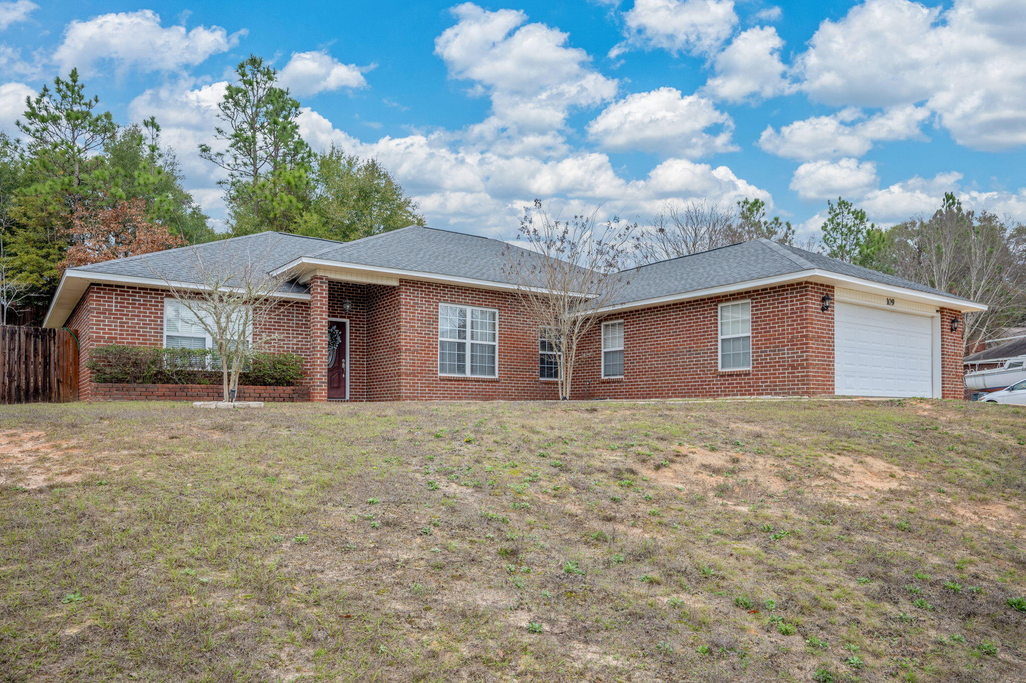 Welcome to 109 Tranquility Dr. in Crestview, FL, where serene lake views greet you the moment you step outside your front door. This well-designed home offers 2,118 sq ft of living space with an open, functional layout that feels both spacious and inviting. The split floorplan provides ideal privacy, while a cleverly hidden laundry room keeps daily tasks tucked neatly away. Enjoy relaxing or entertaining on the screened-in back porch, overlooking a fully fenced, multi-terraced backyard that offers both beauty and versatility. The primary suite is a true retreat, featuring a corner jetted tub, walk-in shower, double vanities, and a private water closet for added comfort. Major updates provide peace of mind: the roof, HVAC, and water heater were all replaced within the last four years. An extra parking pad adds convenience for guests, trailers, or additional vehicles. Thoughtfully maintained and ideally located, this home combines scenic views, smart upgrades, and an exceptional layoutready for its next owner to enjoy.