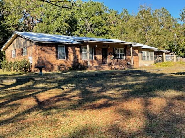 Great possibilities with this older Brick Home with ''GOOD BONES''  Layout is very good.  Owner was a cabinet builder and the kitchen is very good with lots of cabinets and storage. Best part is lot is a full acre completely fenced, and there are two outbuildings for hobbies, or storage.  Electric to both, Water/sink in one.  Open Carport to double as entertainment area, and a bonus sunroom with sink.  This is not heated or cooled but could be very easily.   Home to be sold ''as is''.  Important components upgraded.  Metal Roof is 10-12 years old, HVAC 9 years old, Electric Hot Water Heater 2 years old.,  Windows replaced ,  Corner lot, Paved Old Hiuckory at Mayhair.  Mayhair is a Dirt road,  Address can be changed to Hickory. The large sunroom, enclosed but not included in SF -can be. Requirements, but Old Hickory is paved and a double gate provides access. This provides some privacy too.  The property to the rear is undeveloped and provides privacy.  This is a ONE-OWNER home. It does need a little work, but there are many assets - like the out-buildings and the large one-acre lot.