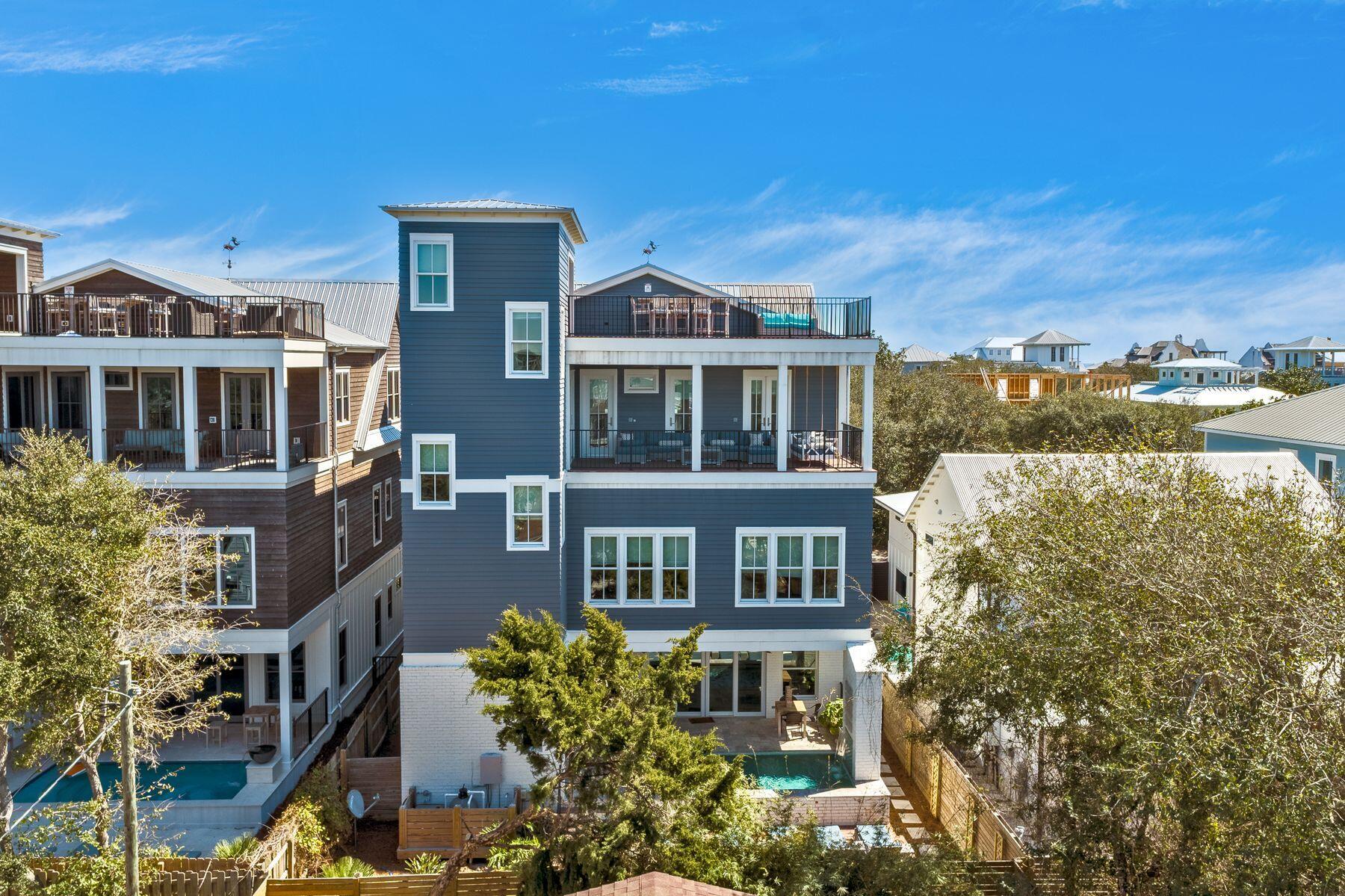 Large Family Vacation Home with Solid Rentals

This magnificent gulf-view beach house is just a hop from sand and sea with space to comfortably sleep up to 22 guests. Close to public beach access in charming Old Seagrove, it's in a quieter 30A location near Seaside, Florida. Spread over four floors, this one-of-a-kind home offers a refreshing take on interior design. Polished wood flooring, salvaged brick, sliding barn doors and clever use of natural elements create an understated informality in this spacious residence. Earth tones bring a calming ambiance to the plethora of rooms. The well-planned space includes an expansive gourmet kitchen for creative entertaining, breakfast gatherings or just hanging out with the chef in this airy social hub. Exposed brick provides a contemporary feel while a full line-up of Wolf and Sub-Zero appliances takes care of everything from food prep to perfectly chilled wine. Seven bedrooms and seven-and-a-half bathrooms make this the ideal primary or vacation home for gatherings just steps from the beach. The property has a proven track record of rental income with $170,000 already on the books for 2022. Recreation space is prime with a third-floor gathering room equipped with coffee bar and fridge and a first-floor game zone big enough for pinball and shuffleboard. Toss burgers and grill steaks in the gourmet outdoor kitchen then relax in the sun on lounge chairs listening to the gushing pool cascade. Multiple decks with gulf views are designed for hosting parties and entertaining, snoozing with a book or enjoying sunset drinks on the top deck. Ample driveway space allows you to abandon the car and adopt a healthy, active lifestyle. Walk, bicycle or ride a golf cart to shops, restaurants, farmers markets and live entertainment at the amphitheater. Spacious, well presented and superbly located close to the beach, this is a property for those who don't intend to compromise.