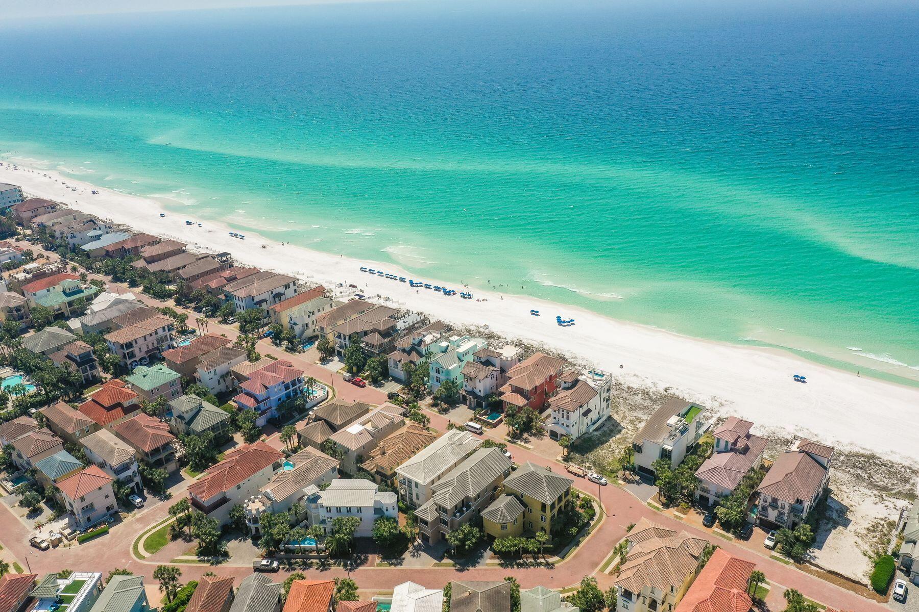 Masterfully designed and perfectly positioned for enchanting views of the Gulf of Mexico, this 4665 square foot home provides an immense amount of space for those longing for a true oasis experience footsteps from the sugar sand beaches of the Emerald Coast. Spanning across three levels and six total bedrooms, amenities abound throughout the property such as expansive living areas, a chef's inspired kitchen, oversized dining areas and multiple levels of both covered and open outdoor spaces, ideal for al fresco dining with friends and family. Prominently sitting one tier off the beach, oversized windows are placed throughout each level of the home to allow natural light to dance throughout each space, while five and two half bathrooms ensure privacy and convenience is top of mind for all who spend time within the property. An outdoor pool with gated surround offers an additional place for outdoor fun in the sun while an expansive bunk area with large closet ensures that storage space is never in short supply.