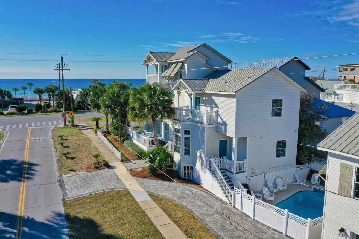 ''The White Whale'' is an iconic coastal retreat located in the heart of Destin's Crystal Beach Neighborhood and prominently positioned on a corner lot, one tier off of the Gulf of Mexico adjacent to excellent beach access. Recently renovated and beautifully designed, this compound oasis has over $236,000 in rental income currently booked for 2021. Notable features include a sizable main house offering exceptional gulf views and open breezeways as well as spacious bedroom suites and a functional open floor-plan and oversized living areas which are ideal for entertaining. In between the main home and the carriage house is a heated resort style pool area with an adjoining sun deck and outdoor entertaining space. Other notable features include ample parking as well as a separate carriage house that is outfitted to accommodate additional guests and serve as an extension of the main house. This rental machine offers a consistent historic income exceeding $200,000+ annually and is being sold turn-key with coastal, designer furnishings throughout. Crystal Beach is one of Destin's most coveted districts offering close proximity to world class restaurants, boutique shopping, Whole Foods grocery, golf courses and Legendary Marina.