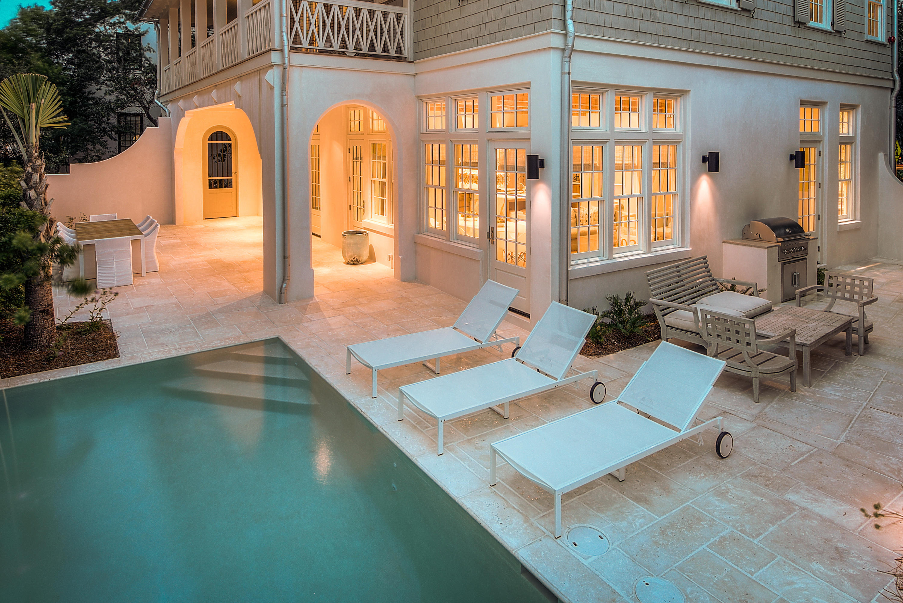 Stunning residence situated along a quiet boardwalk to the beach, on the gulf side of the Rosemary Beach community. Newly constructed in 2017 by acclaimed builder, Benecki Homes of Atlanta, with lush details including: Venetian plaster, rustic wood beam ceilings, wire-brushed Oak floors, marble and limestone kitchen and baths, custom eight-foot interior wood doors replete with Ashley Norton hardware, impeccable interior design by Melanie Turner Interiors, and top of the line Waterworks and Kohler fixtures and faucets throughout. With 5 bedrooms (2 of which are Master Suites), 2 bunk rooms, a bonus room, and a theater room, this exceptional home has it all. Enter through the private courtyard to white peacock pavers leading the way to the pool and outdoor, dining space beyond. As SEE MORE you enter the home you are greeted by an arched entryway with curving Venetian plaster walls, and rustic wood beamed ceiling beyond in the light-filled open living and dining area. The kitchen is a chef and entertainer's dream replete with a professional Wolf range, vintage hangar lights over a waterfall edged marble island, dual Gaggenau refrigerators, sleek cabinetry and ample prep and storage space in the butler's panty beyond. Also off the living area, and accessible from the courtyard, is an elegant powder room with unique wallpaper, gold accents, and a gorgeous marble countertop. Finishing out the first level is a one of the two Master Suites featuring a whitewashed four-poster bed, smooth shiplap walls, and an oversized bathroom with a large natural stone shower and double vanity with Waterworks facets. A tasteful black iron bannister leads you up to the wire brushed oak steps to the second floor where you find three generously appointed suites, two guest and one master, as well as a spacious "double" laundry complete with two sets of Electrolux washer/dryer units. Enter the second level Master Suite via the double doors and you are greeted by a cool, costal color palette throughout and coffered pecky cypress ceilings above. The luxurious, spa-inspired bathroom features a sleekly polished metal soaking tub, and expansive marble double vanity, and floor to ceiling grand marble shower. A very generous master closet is a welcome bonus, as well as access to a balcony overlooking the tree lined boardwalk to the beach and the lovely courtyard below. Both guest suites on the second level feature ample closet space and elegant private baths, and one has French doors leading to the covered balcony. The bright, windows staircase continues to the third level where you will find not only an expansive bonus room, but two bunk rooms (1 with Queen over Queen and Twin over Twin, and the other with Twin over Twin), another large bathroom with walk-in shower and double vanity, and finally a theater room with luxurious lounging chairs and wet bar. This home lives large and can comfortably accommodate 20 guests in the Main House. Across the courtyard, with room for 4 more guests, sits the renovated Carriage House featuring living area, well-appointed kitchen, private bedroom, and covered balcony over a private 2 car garage. Information contained within this listing such as square footage, is deemed to be accurate but is not guaranteed. Buyer to verify.