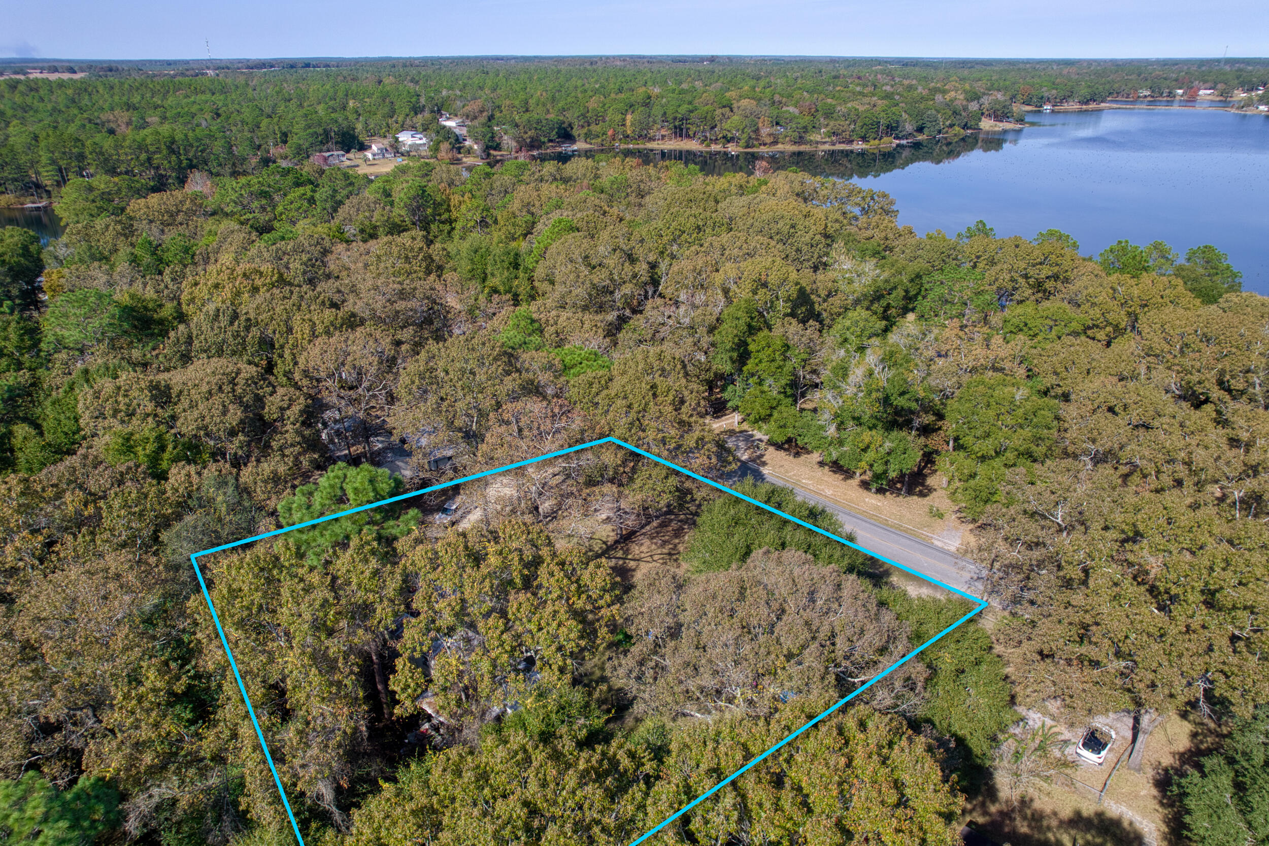 Prime Double Lot Across from Kings Lake - Build Two Homes or Your Dream Retreat! Rare opportunity in DeFuniak Springs! This spacious double lot sits directly across the street from beautiful Kings Lake, offering serene views and endless potential. The existing mobile home is considered a teardown, making this a true land-value sale.
With enough room to build two separate homes, this property is ideal for investors seeking strong resale potential or for a buyer wanting to design a custom dream home overlooking the water. Enjoy peaceful surroundings and the freedom to create what you imagine.

Opportunities like this don't come often—secure this versatile double lot in a growing area today!