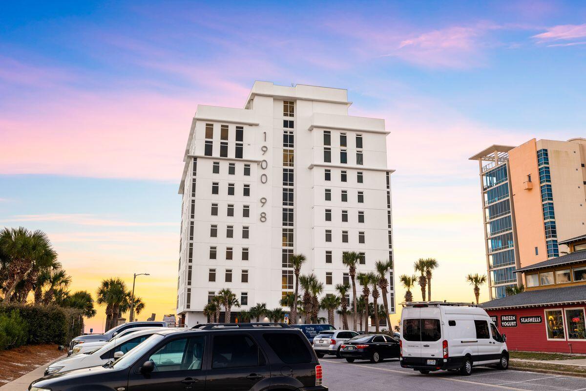 Completely renovated by the current owners in 2023, this luxurious gulf-front condo is superbly located for beach lovers. Boasting a prestigious address, it's the newest development on Destin's pristine Emerald Coast, right next to Henderson State Park. This spacious beach retreat has three beautiful bedrooms, three swanky bathrooms and a built-in bunk room. Step inside this light, bright haven and you'll immediately be captivated by the panoramic views taking in the emerald Gulf of Mexico and miles of coastline in either direction. Sliding doors provide a seamless transition onto the generous 12-ft. terrace where you can look forward to unparalleled sunset views. Glass railings provide unimpeded views of the breathtaking panorama laid out before you. The open floor plan and multiple windows ensure every inch of the living space is bathed in natural daylight. Relax on deep-cushioned sofas and admire the elegant coastal decor and stunning views. After dark, remote-controlled blinds create a cozy, intimate ambiance. Head into the gourmet kitchen and check out the custom cabinetry, top-of-the-line Thermador appliances and gleaming quartz countertops. Impress your guests with drinks served at the lengthy bar when entertaining. The well-appointed bedrooms include two luxury master suites brimming with comfort and luxury. Expansive picture windows, a spa-like bathroom with free-standing tub and ample storage provide a tranquil private retreat at the end of each day. A fully equipped laundry room completes the outstanding accommodation along with garage parking, gated security and deeded beach access. Ride the climate-controlled elevator to the pristine rooftop pool and spa or burn those calories in the state-of-the-art fitness room. With just 16 luxurious units, privacy and exclusivity are assured. Fine dining, shopping and entertainment are within easy reach of this exceptional condo making this an enviable hideaway for keeping busy  or doing nothing at all.