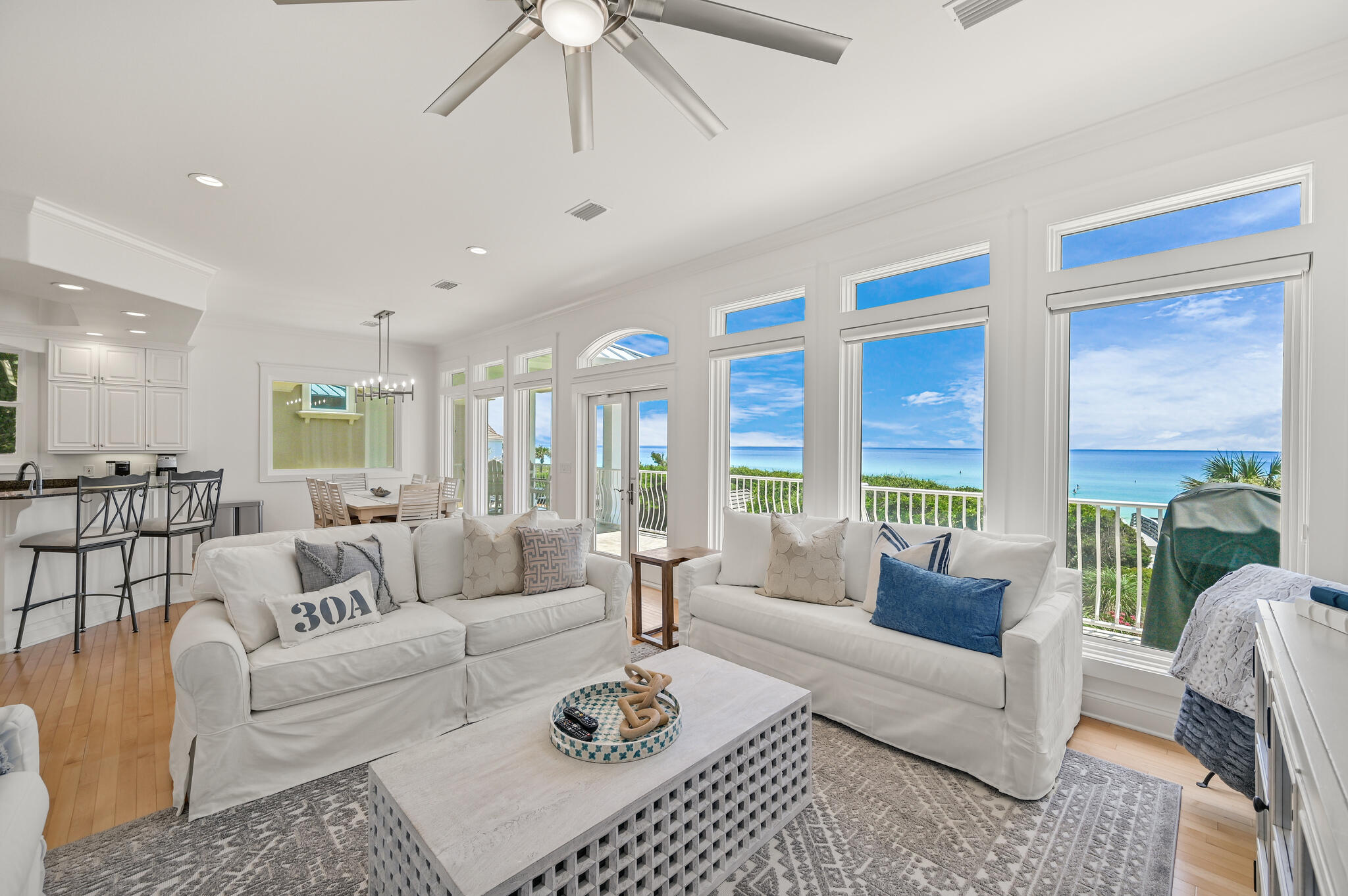 Discover coastal luxury at its finest with this stunning gulf-front Seagrove Beach Cottage, located at 36 S San Juan Avenue, Santa Rosa Beach, FL 32459. This exquisite 4-bedroom, 3-bathroom home spans 3 floors with 57 feet of breathtaking beach frontage, offering direct access to a serene, uncrowded beach via a private boardwalk through a secluded tree arbor atop a high dune. Renovated in 2022, 36 San Juan features a fresh, coastal design with all-new furnishings, making it the perfect family retreat or investment opportunity. The first floor offers a king bedroom, a full bath, and an entertainment room with a wet bar and sleeper sofa, providing easy access to the beach walkover. The second floor showcases a spacious living-kitchen-dining area with sensational Gulf views from the full length balcony. New GE Monogram appliances were installed in 2024. Two bedrooms, and a large laundry room finish this floor. Ascend the two story open stairwell to the third-floor master suite, capturing views of the sparkling white sandy beach. Amenities include a large bathroom, soaking tub, private balcony, walk in closet, and adjustable base bed. Outside, upgrades include a new roof, new interior and exterior paint, new AC units, a new paver driveway, and new landscaping for the large rear yard. With no HOA fees and a prime location just a short bike ride from Seaside and central to all of 30A's dining, shopping, and entertainment, this cottage offers both exclusivity and convenience, and is perfect as a primary residence, vacation home, or rental property. Don't miss the chance to own this slice of paradise in the heart of Seagrove Beach.