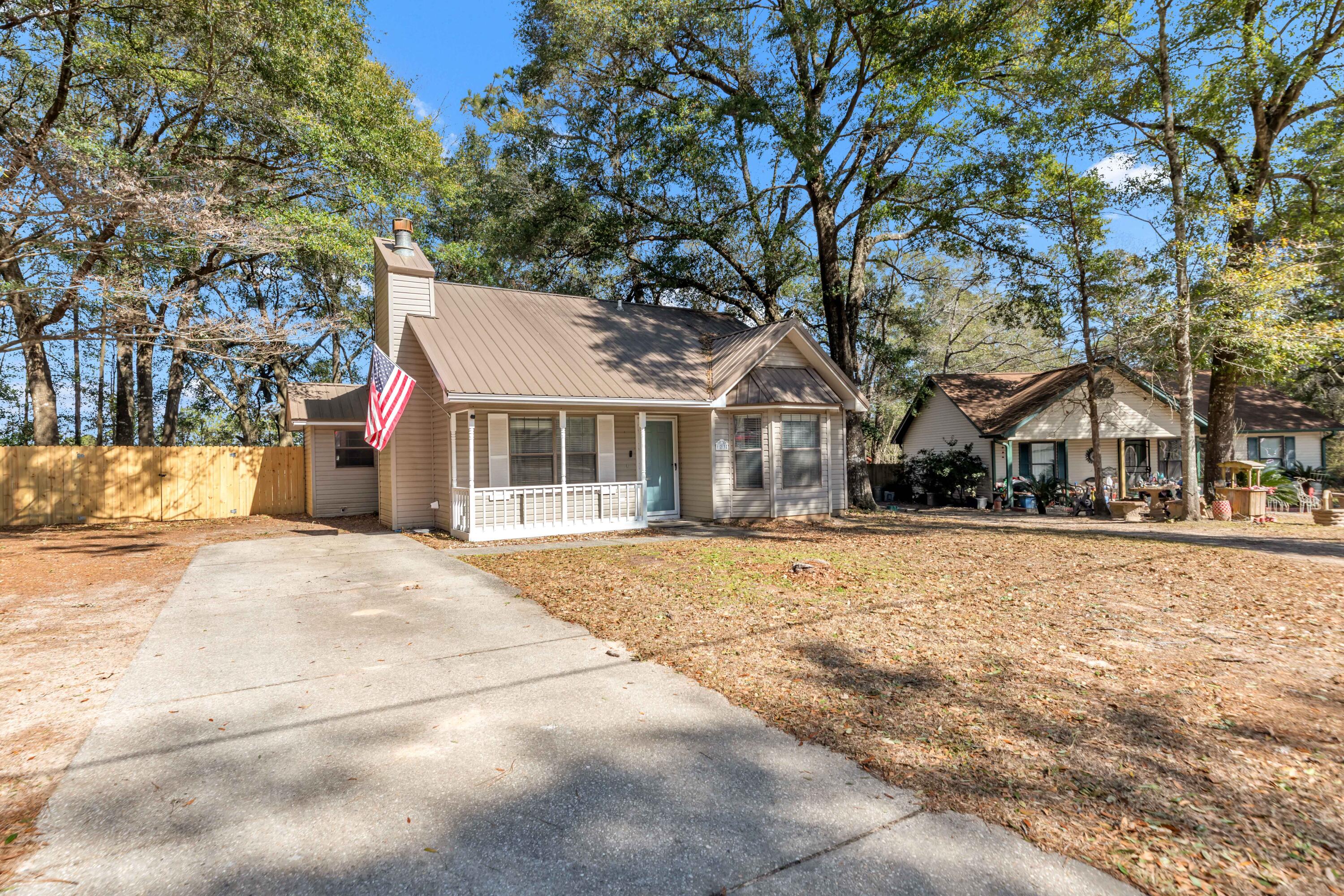 This charming two-bedroom, one-bath home is nestled in the well-established neighborhood of Beacons Bend and sits on a spacious lot just shy of a quarter acre. Enjoy peace of mind with a durable metal roof, a large fully fenced backyard, and no HOA restrictions! The generous driveway and backyard provide plenty of room for boat and trailer storage.

Conveniently located just a stone's throw from dining, shopping, and Crestview High School, with easy access to multiple military installations. All kitchen appliances convey, making this home truly move-in ready.

Whether you're looking for a place to call home or a solid investment opportunity, this property checks all the boxes. Schedule your showing today before it's gone.