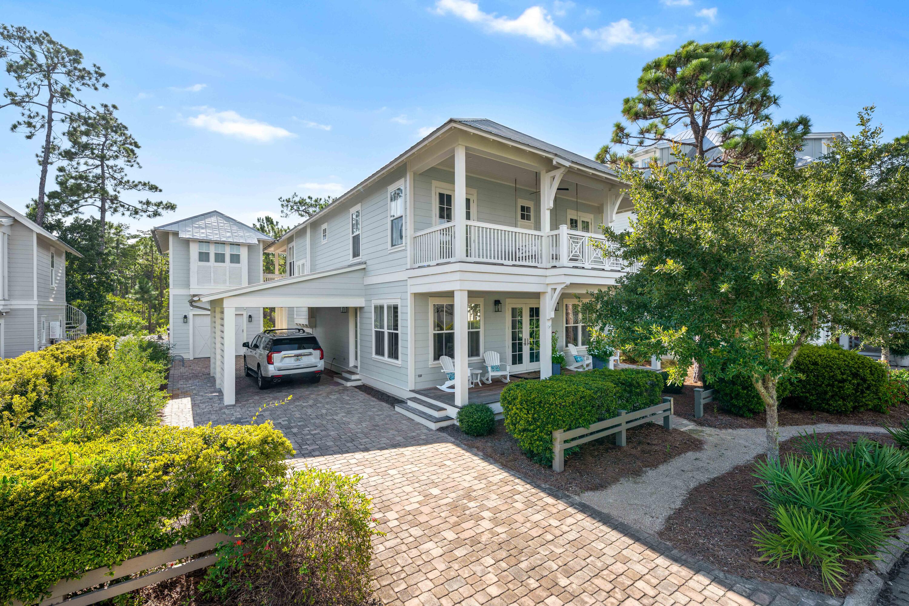 Welcome to 655 E Royal Fern Way, where coastal elegance meets modern convenience in the vibrant WaterColor community. This stunning home features 5 bedrooms, a bunk room, and 5 1/2 baths, making it perfect for large families. Custom closets designed by Artisanbilt to maximize storage and organization. Upon entering, you'll find an open-concept living space filled with natural light, high ceilings, and stylish finishes, ideal for relaxation and entertaining. The gourmet kitchen boasts stainless steel appliances, granite countertops, and ample cabinet space. Decorated by Kirstie Corollo at Bella Beach, the interior exudes sophisticated style. The master suite serves as a private retreat, while the outdoor patio offers a serene escape. Enjoy access to community amenities which are plentiful!
