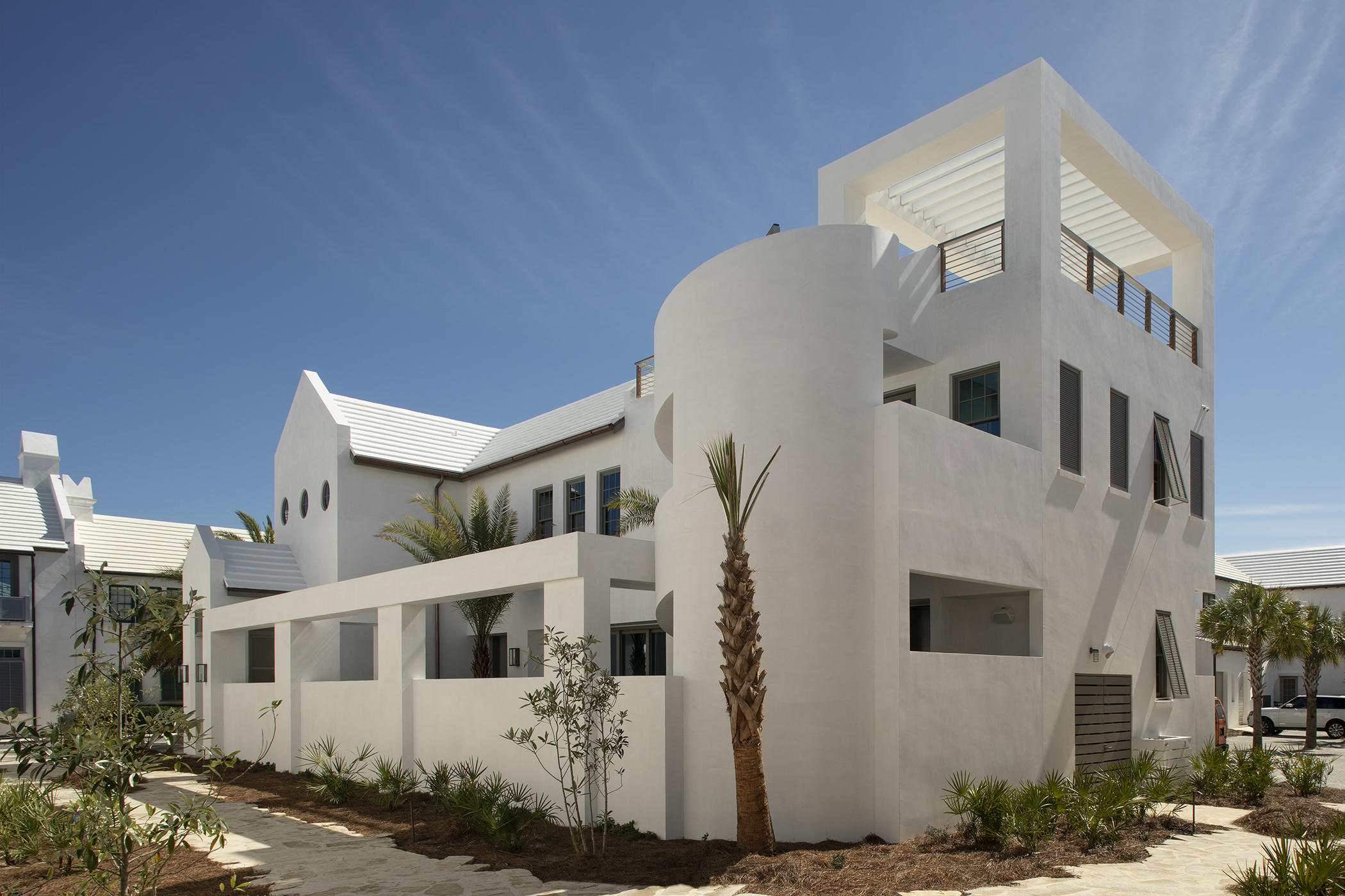 A Boheme Design architectural firm delivers modern living lifestyle to interact with the peacefulness & solitude of the famed Palmera Park. Located south of 30a, the serenity of the park setting further enhances the homes design and elegance. This stunning property is within close walking distance to the Gulf Green. Livability is not questioned with this property.
 
62 S. Charles Street allows for full-time residency with the generous living aspects the home offers with its 3,845 square feet of conditioned living area and abundance of outdoor living. This 4 bedroom property consists of 2 master suites and 2 guest bedrooms, laundry rooms on each floor, a media room with beverage center, and captivating outdoor spaces.
The kitchen, dining, and living rooms introduce the large cou and pool with views through the 30' long multi-slide doors which open to create both spaces as one.  

The outdoor space is an architectural master piece showcasing the 32' water wall spilling into the length of the pool flanked by a gas fire pit.  West of the pool is the covered summer kitchen featuring a Wolf grill and Sub-Zero icemaker & refrigerator shadowed by the masterful concrete spiraling staircase leading to the 3rd story roof terrace having Gulf views.  Entertaining is limitless with the abundance of indoor & outdoor living.
 
Each of the master suites orients to views overlooking Palmera Park.  The 1st floor master suite hosts its own private court with outdoor soaking tub.  Each of the master suites provides dual vanities, generous showers surrounded by floor to ceiling marble.  Lacava plumbing fixtures for each.  Both master suites accommodate walk in closets with large multi-slide doors that open to capture breezes and sounds of a still night.  

The 1st floor carries shell stone flooring throughout which continues to the courtyard.  The 2nd floor transitions to Walnut creating a distinctive look while keeping the home's contemporary design.  

Saving the best for last is the magnificent kitchen appointed with a large island aligned to the courtyard views.  This gourmet kitchen boasts a 48" Miele range, Sub-Zero refrigeration, icemaker, and wine cooler. The dining and living are congruent with the kitchen for entertaining.  

12' ceilings carry throughout first floor allowing for the clad floor to ceiling marble surround of the fireplace.    The Control 4 audio & visual system operates the home with ease & simplicity.  

The arrival to the 2nd floor is passed by a Zebra wood clad stair hall with an Italian-made polished stainless steel railing by Maretti.  Upon arrival to the 2nd floor, you will immediately find the media room with a wet bar featuring the home's 3rd icemaker and beverage refrigerator.  The 2nd floor hosts 2 very generous guest suites with beautifully appointed bathrooms and large closets.   

The private owners Beach Club now under construction east of this home along with the near completion of ZUMA Wellness Center.  This home is a must see.  

Furnishings do not convey with the sale of the home but can be purchased in addition to the listing price.