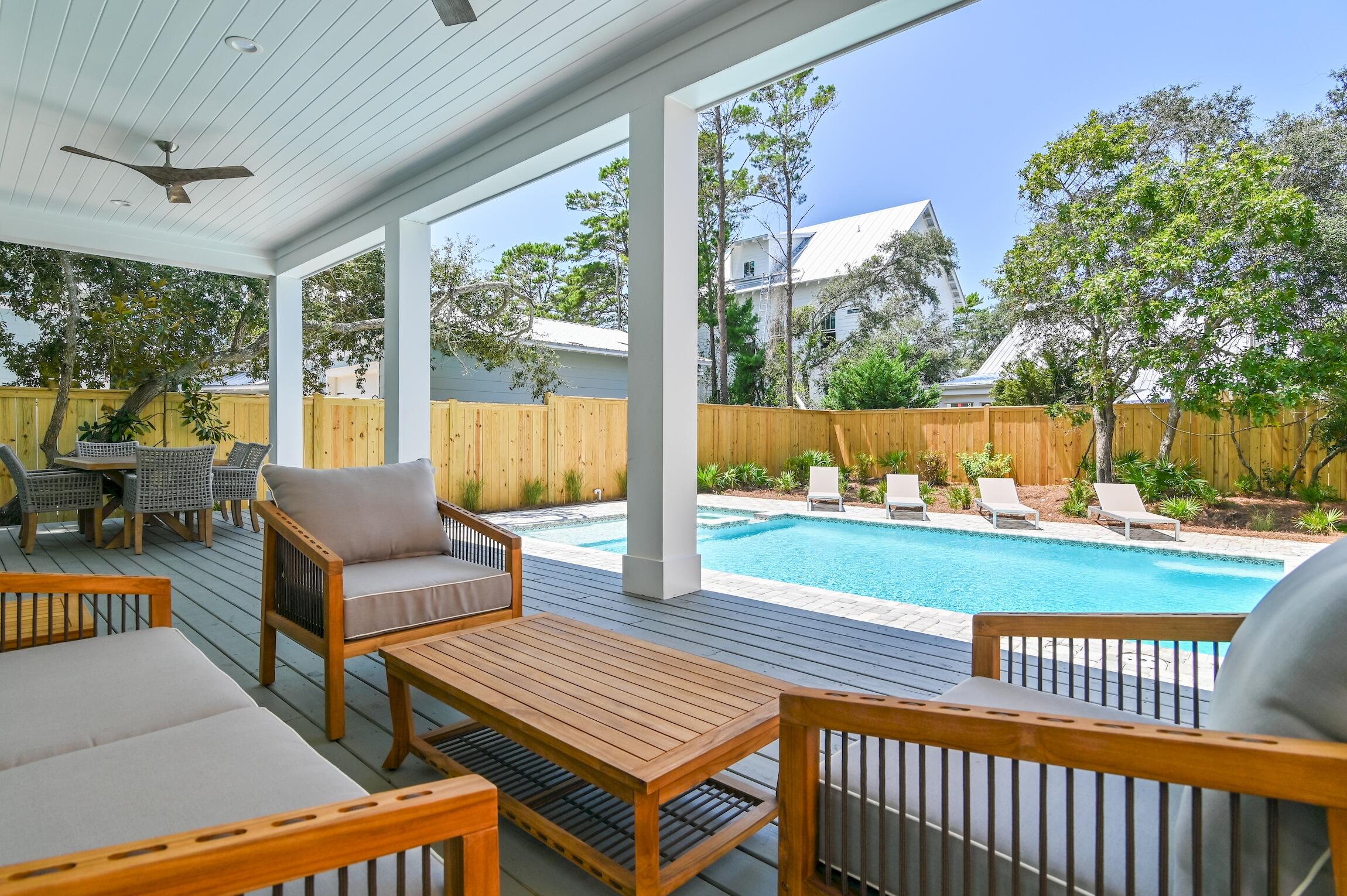 Welcome to the epitome of coastal luxury living in the heart of Seagrove, a masterpiece of new construction near Eastern Lake. This beachside haven boasts 6 bedrooms and 7.5 baths, accommodating up to 20 guests with ease. Impeccable design merges modern elegance with the relaxed charm of the coast.

Every detail has been carefully curated, ensuring a harmonious blend of aesthetics and functionality. Each bedroom features an en-suite bath, while the grand master suite indulges you with a spacious closet and a lavish bathroom, crafting a serene retreat.

Entertainment abounds within this exquisite abode. A dedicated bunk room comfortably sleeps six, while the secondary living space, complete with a wet bar, table tennis, and two tv's becomes a hub of socialization and fun. Immerse yourself in a symphony of sound, as the indoor living area and the outdoor heated pool/spa are equipped with Sonos surround sound.

Just steps away from the sprawling Eastern beach access, the allure of the ocean beckons. The front yard, embraced by a wooded landscape, grants both privacy and a touch of nature's tranquility.

This haven is turn-key and professionally decorated, making it rental ready and an ideal investment opportunity. Stay connected with the commercial-grade Wi-Fi system, and enjoy modern entertainment with included TVs.

In summary, this exceptional beach house encapsulates the essence of coastal opulence. Whether as a personal retreat or an income-generating asset, this is an invitation to experience luxury living in a class of its own. Seize this opportunity to own a slice of Florida