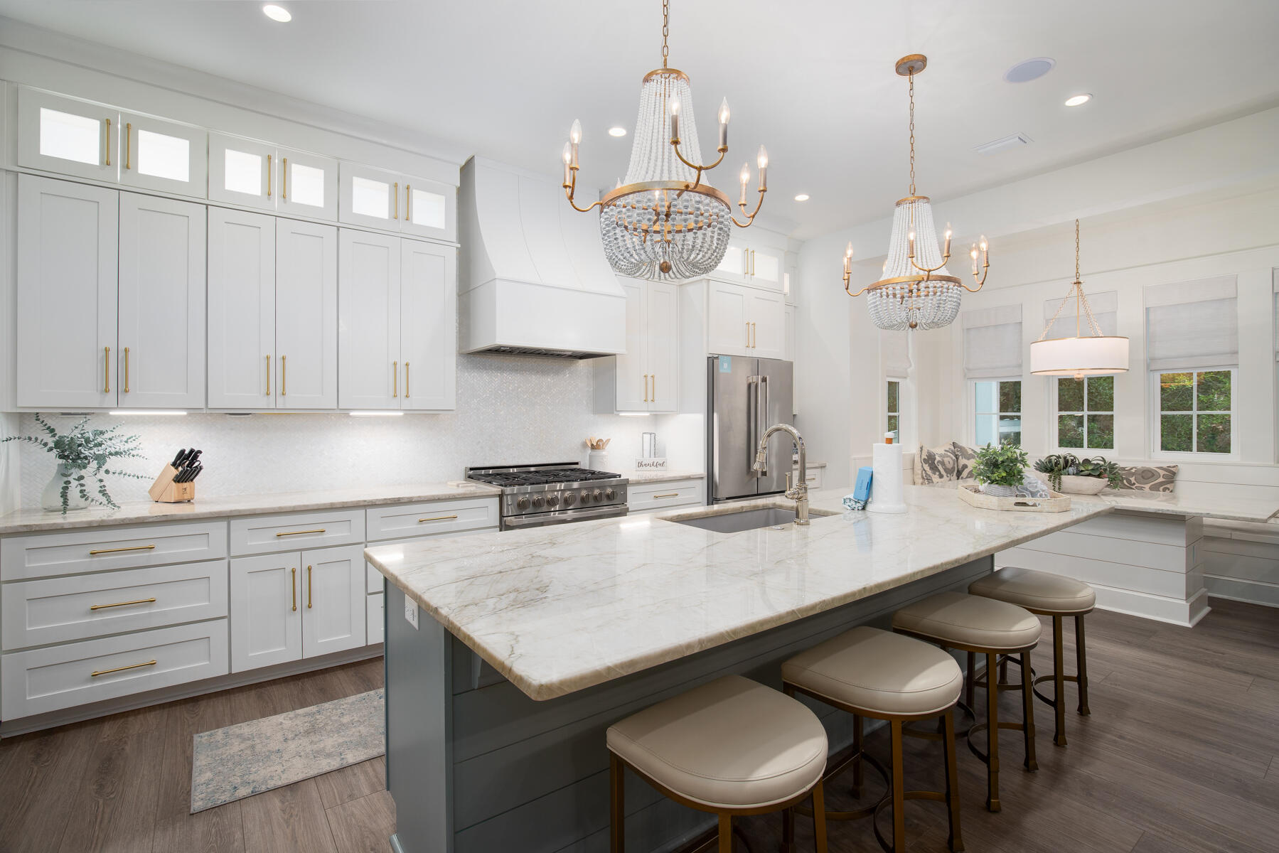 Welcome to this stunning five-bedroom cottage, built in 2021, which effortlessly blends modern living with classic southern charm. Nestled in the heart of Old Seagrove, just west of Highway 395, it is located within a half-mile radius of Seagrove's pristine white sugar sand beaches, the iconic community of Seaside, and a variety of charming shops and restaurants. This thoughtfully designed home combines comfort, luxury, and functionality, all in a prime location. The home's architectural appeal is enhanced by spacious covered porches at both the front and back, ideal for enjoying the serene surroundings while offering the perfect mix of privacy and accessibility. Upon entering the home through the welcoming south-facing covered porch, you're greeted by a spacious entryway that flows seamlessly into the open-concept living, kitchen, and dining areas, overlooking the rear lanai and private pool. This creates a natural connection between indoor and outdoor living. The chef's kitchen features custom cabinetry, stainless steel appliances, and a generously sized center island, perfectly positioned for easy interaction with the dining and living rooms, making it an entertainer's dream. The Sonos system is integrated with speakers throughout the downstairs area and on the patio, providing seamless audio both indoors and outdoors. The outdoor porch also features a mounted TV for added entertainment.
The first level includes a roomy mudroom with a second full refrigerator, and a second master bedroom suite, ideal for guests. The home's interior is equally impressive, boasting soaring 10-foot vaulted ceilings and an expansive open floor plan designed for today's lifestyle. Upstairs, you will find four additional bedrooms, including the master suite with a large master bathroom. A charming bunk room is included, and each bedroom features an en-suite full bathroom. Two of the bedrooms also have access to a screened-in porch, providing a peaceful outdoor retreat.
The relaxing outdoor area boasts a beautiful heated pool with a water feature and splash pad, surrounded by ample living spaces and perfect for entertaining. This outdoor oasis includes a grilling station, ideal for summer barbecues, with direct access from the front driveway, making it easy to transition from a day at the beach to outdoor relaxation. An outdoor shower is conveniently located on the side of the house. Lastly, the home features a private one-car garage and a driveway that comfortably accommodates four vehicles, including a crushed granite parking area. This property is being sold fully furnished, with the exception of personal items, and includes high-end designer furnishings.

 *Buyer to verify all measurements and information deemed important. *