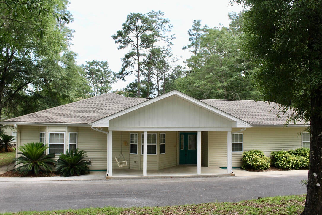Here is one you will love!!! Attractive contemporary designed home in Country Manor, one of DeFuniak Springs nicest subdivisions.  Well located.  Easy access to all amenities.  The home sits on two beautifully landscaped corner lots.  Wonderful design.  You will love the open living room, kitchen and dining room floor plan.  You will love this custom design that includes an office.   Bedroom # 3 could easily function as a 2nd office giving you a 'his and her' office combo.  The home is in excellent condition, vacant and move in ready.  Included is an attached two car garage, and a detached workshop.  Easy to show.