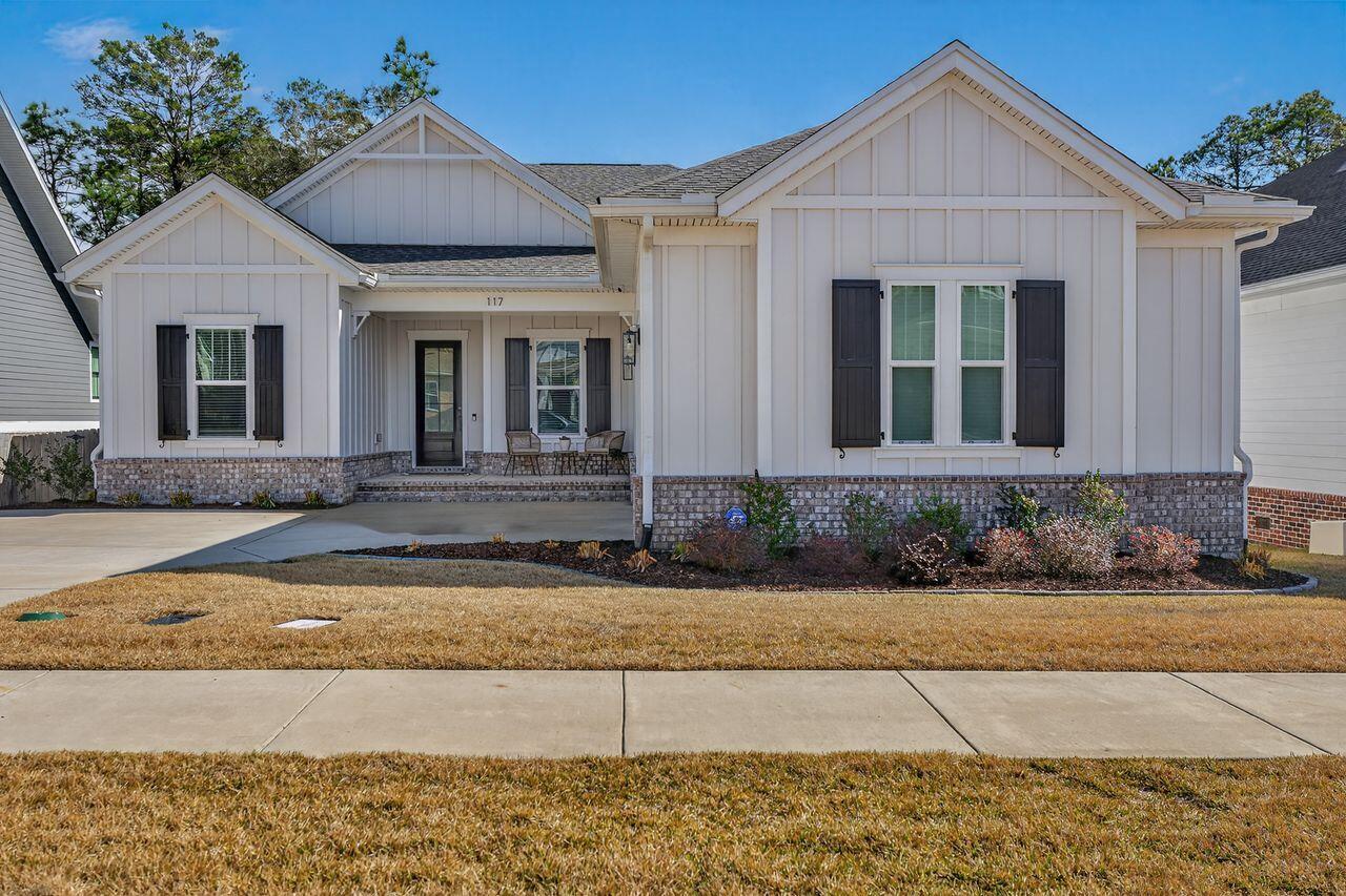 Beautiful Hickory Craftsman floor plan by Tidwell Builders offering single-level living with 4 bedrooms, 3 baths, plus a flex room/office with custom built-ins. This home features 10' ceilings, engineered wood floors, upgraded lighting, and a cozy brick gas fireplace with wood mantel. The chef's kitchen includes quartz countertops, large island, apron-front sink, slide-in gas range, custom wood hood, walk-in pantry, mud room, and a desirable butler's pantry with extra cabinetry. The primary suite offers double vanities, soaking tub, walk-in shower, spacious closet, and custom barn door. Enjoy outdoor living on the tiled screened porch and Trex deck overlooking a massive fenced backyard with no future building behind. Deer Moss Creek amenities include trails, bike paths, pool, clubhouse