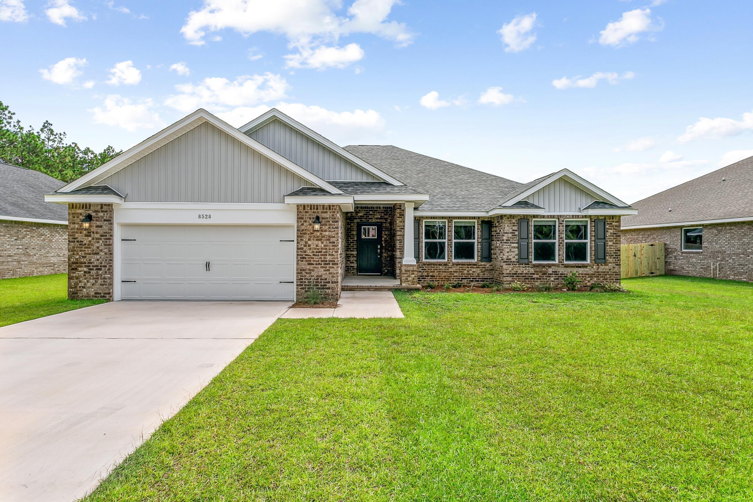 New construction in Buckeyes Landing! The Liberty is a spacious 4-bedroom, 2-bath home featuring an open layout and modern finishes throughout. The kitchen offers stainless steel appliances, granite or quartz countertops, slow-close cabinetry, an island, and a large pantry. The split floor plan provides added privacy, with the primary suite including tray ceilings, double vanities, a tiled walk-in shower, and a garden tub. The fourth bedroom offers flexibility as an office or playroom. Crown molding accents the main living areas, and blinds are included.
 Buckeyes Landing is ideally situated in the heart of Navarre. The neighborhood is located off Bob Tolbert Road, providing convenient access to major routes including US-98 and State Road 87 for easy commuting east toward Destin or west toward Pensacola. Just minutes from local amenities - including shopping, restaurants, parks, highly rated schools, and world class beaches. 
Projected completion is June 2026.