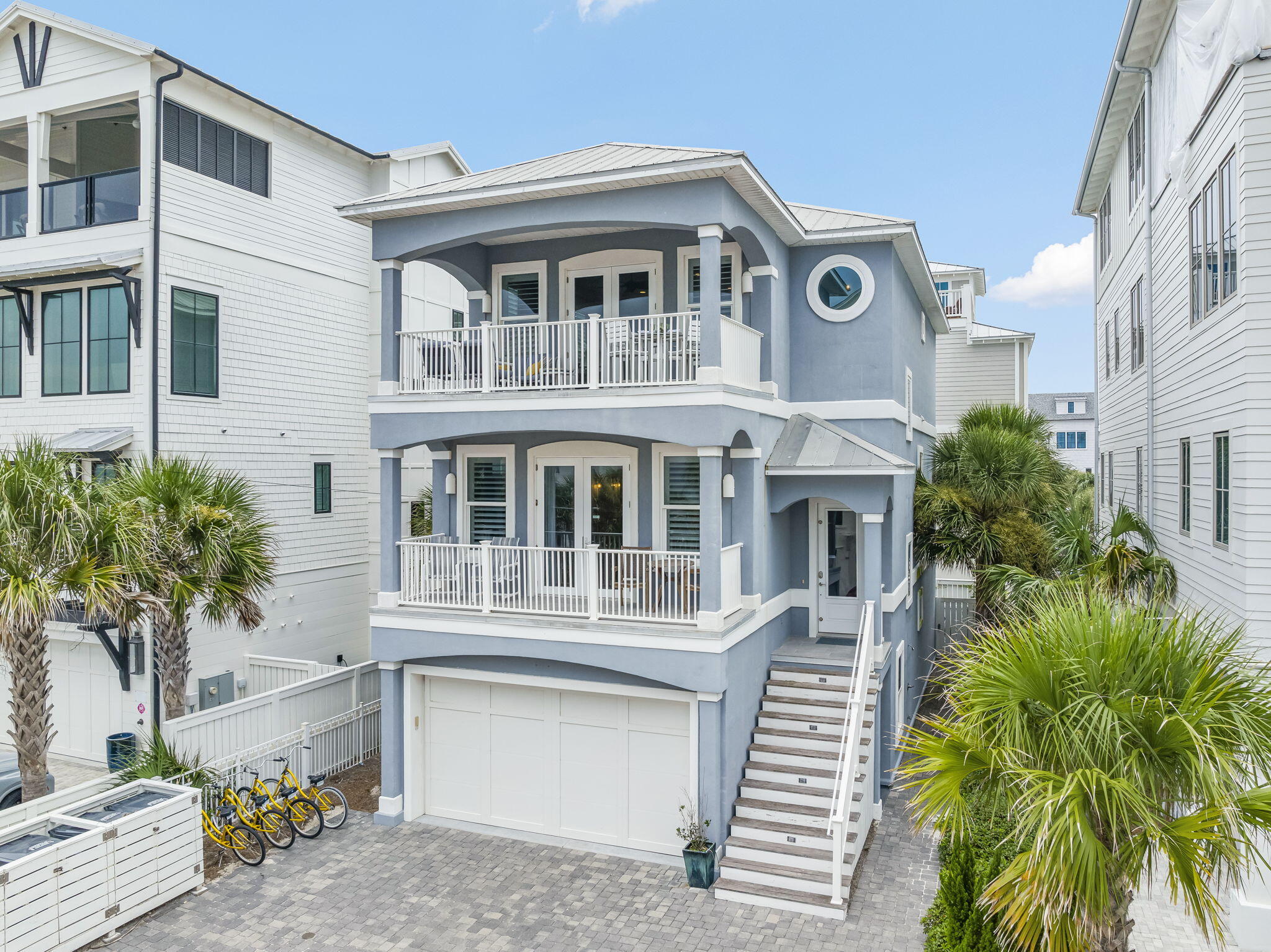 FABULOUS OCEAN VIEW! 175 FEET OF PRISTINE BEACHFRONT SHARED BY ONLY 14 HOMEOWNERS — NO CUSTOMARY USE ISSUES! This rare opportunity awaits at 93 Emerald Cove Lane, an exclusive coastal retreat in Inlet Beach with direct gated, deeded private beach access just one tier off the Gulf. Tucked inside a boutique HOA south of Highway 98/30A and less than a mile to Rosemary Beach (via convenient back roads), this 5-bedroom, 3.5-bath home blends luxury, strength, and effortless beachside living. On the first floor, you'll immediately feel at home with light gray wood-tile flooring, soft blue shiplap accents, and an elevator that travels to all levels. This floor also includes a spacious guest suite with a fully remodeled bath featuring quartz countertops and custom tilework. The shiplap continues  up the stairways to the second floor, home to three bedrooms including the true master retreat with a private lookout balcony and pristine Gulf views. The master showcases a wood accent wall, a Pecky Cypress barn door, a spa-like bath, and a fully built-out walk-in closet. Another full bath on this level continues the elegant coastal palette of blues, whites, and grays.

On the third floor, a light-filled open living space seamlessly connects the kitchen, dining, and living areas. Enjoy a gas fireplace, a cozy sitting room with French doors, and a redesigned chef's kitchen with stainless steel appliances. Step outside to the expansive balcony, perfectly positioned for breathtaking Gulf sunsets. This level also features an additional guest bedroom.

Forever-protected Gulf views stretch west over the state preserve, while the community pool is just steps away and rarely crowded. Built with ICF construction, this home is up to 10 times stronger and significantly more energy efficient than traditional builds. Additional upgrades include a backyard fenced patio, driveway pavers, and a refinished oversized garage with parking for 3-4 cars plus space for 3 more outside.

Ideally located in Inlet Beach, just east of Rosemary Beach and minutes from the boutiques and dining of 30 Avenue, this immaculate home is in like-new condition and would make a perfect full-time residence, second home, or investment property. Don't miss this rare chance to experience the very best of coastal luxury living along 30A.