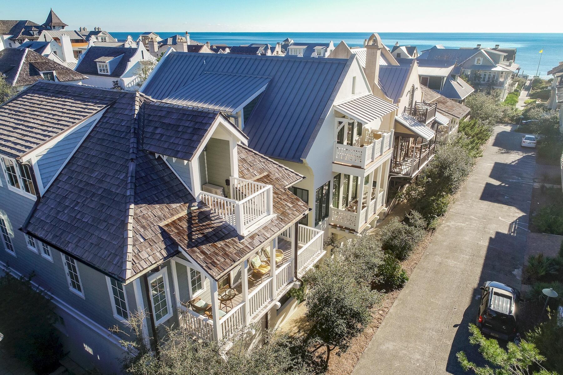 Designed by Michael Piazza, this popular Rosemary Beach cottage is located south of 30a, and close to the beach and village shops. Gulf views can be enjoyed from the 2nd and 3rd floor balconies. The Barbados Pool, one of four private Rosemary pools, is across the street. The beach is an easy one minute walk away. The three story main house offers Viking appliances, hardwood flooring, and wet bar. The first floor features an open living - kitchen floor plan with twelve foot ceilings. An abundance of windows offering natural light and two kitchen islands make this ideal for family gatherings.
The second floor includes three en-suite bedrooms plus laundry room. Upon arriving at the third floor, you'll find a kids' delight with seven bunks and two separate bathrooms. The carriage house offers two full levels of living with a full kitchen, built in bunk and king bedroom loft.   
The exterior offers two courtyards, a Viking outdoor grill, two car garage and an outdoor shower. The dutch west indies architecture is complimented with white stucco, cedar siding, cedar shake roof and peacock pavers. This favorite of many returning families for years is now being offered fully furnished and turn key rental ready.