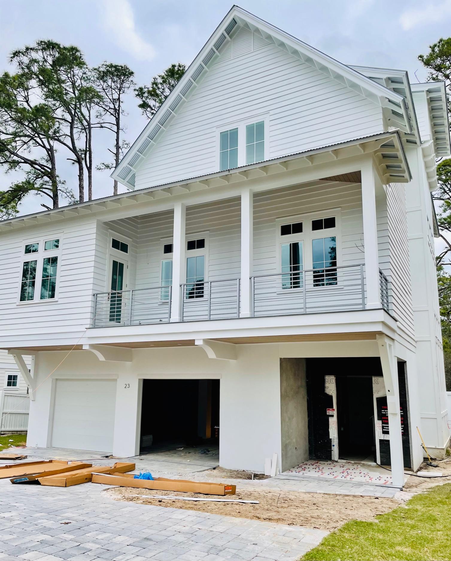 This amazing custom home can be a coastal retreat for generations of family and friends. Offering two master bedrooms, 5 full bathrooms, 2 half bathrooms, third floor flex space and over 1000 square feet of covered outdoor living, dining and entertainment space, this home can provide the full time or second home buyer everything they need. The truly unique touches are found in the added extras: cypress tongue and grove ceiling treatments, elevated second floor pool, custom wainscoted stairwells and a dual fuel 48 inch range for the gourmet chef in the family.  With 12 foot ceilings, oversize garage and a light filled office with private porch, this can be your dream home.  Don't wait to see this incredible property.