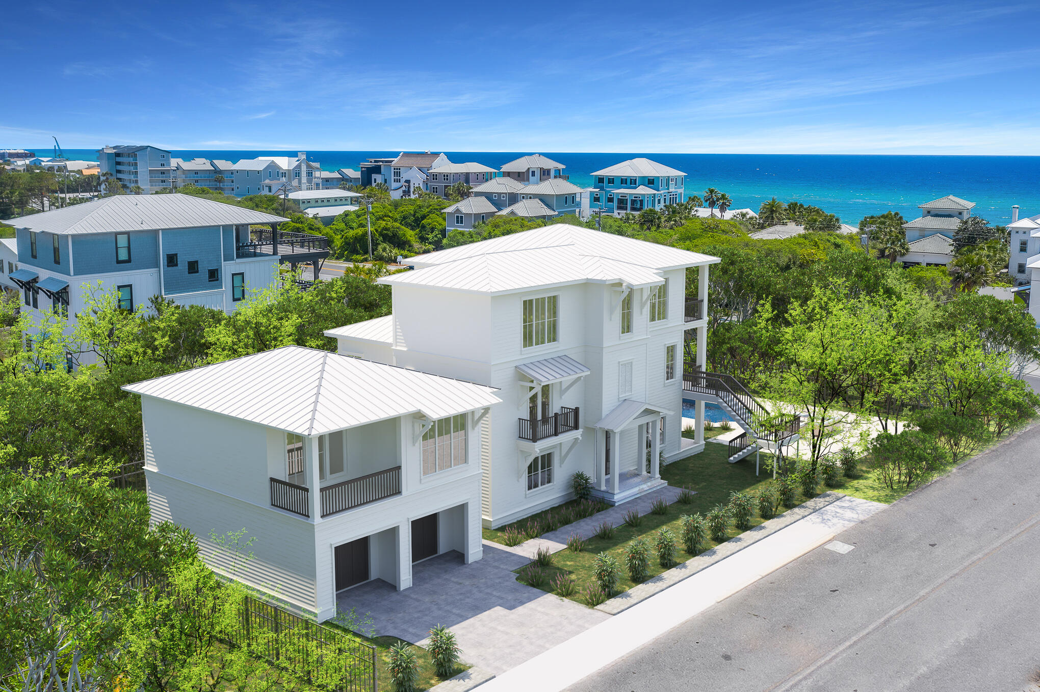Experience the ultimate vacation experience in this uniquely designed beach sanctuary! Incredible gulf views from both the second and third of the property offer the opportunity to enjoy the beautiful emerald waters right from your own porch. Astounding architecture paired with a flawlessly planned floor plan create space for large gatherings of families and friends to experience a true 30A retreat. Features of the property include a grand great room with dining for the entire party, a private resort-style pool, incredible outdoor living, a separate detached carriage house, private elevator, parking for over eight vehicles and much more. 

Step into the first floor of the property to find a space created for the young at heart. This floor contains a separate secondary living area which includes space for a large TV, sectional and additional gaming space. The recreation room seamlessly lives with the outdoor entertaining area boasting a large resort-style pool. Additionally on the ground level, there is a pool bath, spacious guest suite, large bunk room and oversized laundry facility. 

As you climb to the second floor you will be welcomed by the bright sunlight in the grand stairwell. This floor holds the main living space as well as a huge dining area offering room for the entire family to gather for dinner. From the dining space move across the open concept to the amazing chef's kitchen. The kitchen boasts built in Blue Star refrigeration, 48" Blue Star gas range, a custom range hood,  dishwasher and a microwave drawer. Additionally a beverage fridge and ice machine are off the side bar of the kitchen. No amenities were missed in this kitchen! The huge living space is located across from the kitchen and offers a wonderful area for the family to enjoy time together. Furthermore on this floor, you will locate the enormous master suite showcasing a private balcony as well as the master bathroom with double vanity large walk-in shower, free-standing tub and over-sized master closet. A second powder bath and laundry are also located on this level. 

The third floor of the property welcomes you into the 3rd living space and recreational area. This room boasts 180 degree gulf views, a huge covered balcony as well as a wet bar with ice machine, beverage fridge and sink. An additional convenient powder bath is found off the living space here. Moreover, this floor showcases two additional junior suites.

Away from the main house, you will discover a separate detached carriage house. The carriage house offers its own private kitchen, living and laundry. Two additional guest suites are found here. This private space offers flexibility when large parties stay at the home. The first floor of the carriage house contains the 2 car garage. This space is perfect for not only parking but also storing all those necessary beach items!

The outdoor living space ais incomparable! With deeded beach access only steps from the front door you will be enjoying the white sand and emerald waters within minutes from leaving the house. Back at the property, you will find the large pool for the whole family, firepit area and an outdoor TV for watching while swimming! In addition, right off the pool you will find an amazing outdoor kitchen with large gas grill, fridge and sink. There is also a private outdoor shower off the back of the main house for after beach showers. Finally in addition to the garage space, the property offers parking for at least an additional 6 vehicles.

Features of the property include an elevator; white oak hardwoods throughout; marble in many of the bathrooms; unique wood on the great room ceiling; quartitze countertops in the kitchen; beautiful lighting; incredible plumbing fixtures; amazing tile on the back-splashes and bathrooms; multiple tankless hot water systems; a metal roof; and much more! The property offers sleeping for 30. A full listing of the property specs is available upon request. Do not miss your opportunity to own the ultimate vacation rental, you will not find another property like this in our area!

*Finished photos are the same floor-plan built in another location.