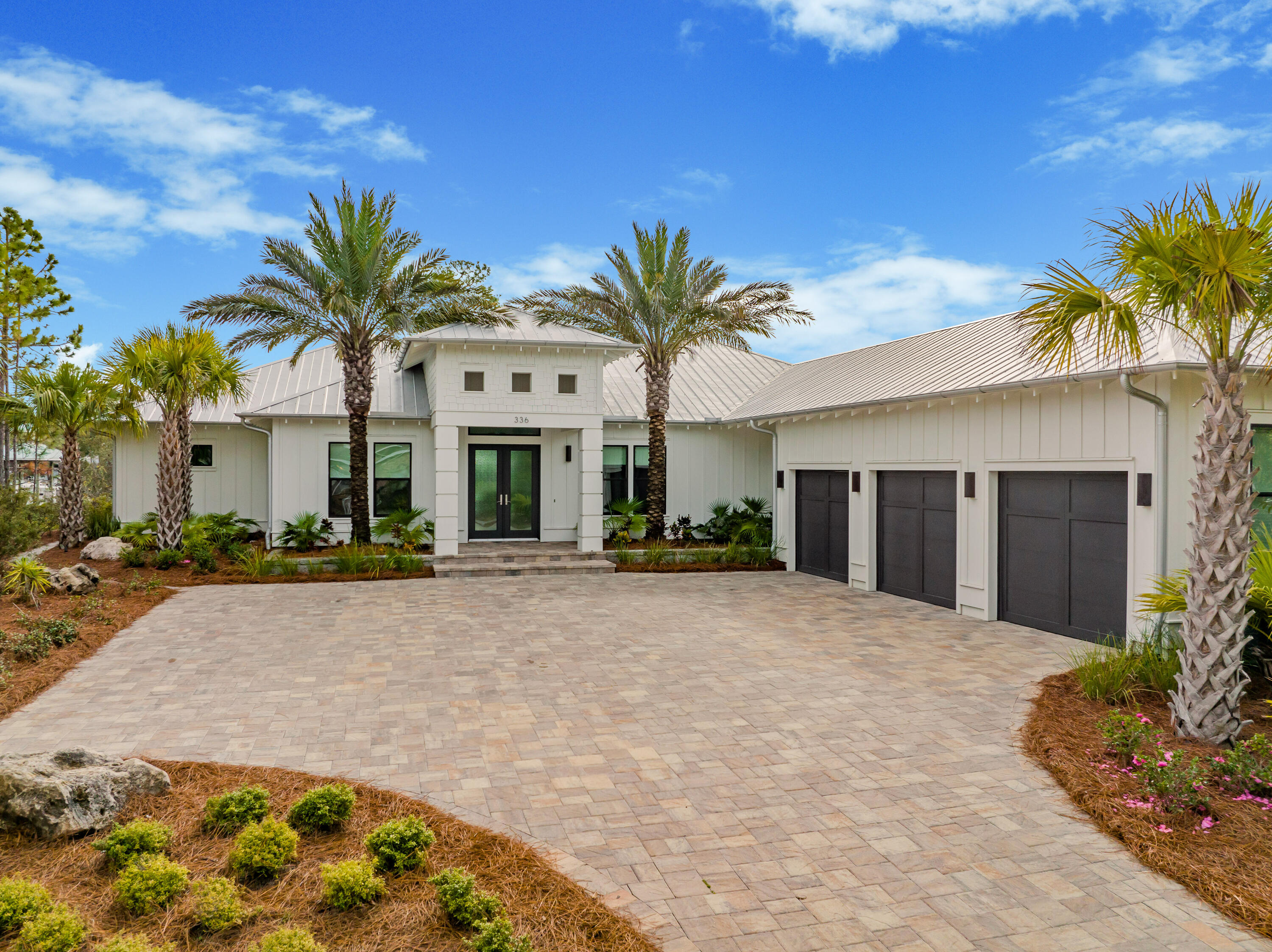 Stunning waterfront estate offering 100 ft. on the bayou with easy access to the Bay. This is a newly constructed one level home with beautiful curb appeal, contemporary lines, metal roof & a 3-car garage. The lot is over 1/2 an acre on protected, deepwater Buck Bayou in Santa Rosa Beach connecting closely with Choctawhatchee Bay. There is a fantastic dock encompassing a 42-ft. covered slip with lift capable of accommodating up to a 50-ft. boat along with two jet ski launches. You will be impressed from the moment you step into the shiplap entry with a direct focal point of the water. Beautiful natural stone floors throughout & large sliding glass doors enhance the breathtaking views and natural light. Exceptional lanai, summer kitchen, expansive pool deck & yard to enjoy coastal living! The raised ceilings with exposed beams and open floor plan allow the home to feel very spacious. Living area flows effortlessly to the upscale kitchen and waterfront dining area. The Chef's kitchen features ample cabinets and Quartz island & breakfast bar great for casual dining. Kitchen Aid stainless steel appliances with ceiling height backsplash accents the sleek vent hood and freestanding shelves. The custom pedestal lighting above the Quartz island add an elegant touch. The waterfront dining area is perfect for entertaining or the covered lanai complete with vaulted tongue and groove ceiling and linear gas fireplace. The custom herringbone barn door is a focal point for the dining area with an upscale theatre on the other side for an additional purchase. This is the most incredible custom home theatre and has all of the bells and whistles along with phenomenal acoustics and imagery. *The basic custom home theatre package is an additional $100,000, however, the upgraded home theatre package is also available for $250,000. Please inquire for specific details.* This is a unique feature that sets this home apart. If the buyer is not interested in the theatre, this waterfront room will be converted back to original condition which encompasses a wet bar, vaulted wood ceilings and exceptional water views from the large windows. This can be the perfect lounge, family room or additional bonus room facing the bayou.
The spacious waterfront master suite has stunning vaulted ceilings and breathtaking views. The split floor plan allows for extra privacy and the craftsman details of the vaulted wood ceiling and shiplap accent wall even carries over to the elegant and generously sized ensuite master bathroom. The master bath also features cypress cabinets, unique contemporary lighting, Quartz and a freestanding deep soaker tub showcased in front of a marble-clad walkthrough shower with multiple rain heads. The shower tile in all bathrooms extend to the ceiling for an upscale and polished aesthetic. There are two generously sized guest bedrooms with the stone floors and complete with exceptional guest bathrooms. In addition to this is a third guest bedroom that is currently being used as a gym, hallway bunks and a nice laundry room with full size washer & dryer, laundry sink and storage. A mudroom leads to the 3-car garage that has epoxy flooring and storage. The summer kitchen features gas grill & hood, beverage fridge and sink to enjoy barbecue and outdoor dining. Take in the serene views of the bayou while relaxing on the covered lanai or plentiful open air outdoor spaces. The natural stone pool deck is designed with contrasting permeable stones that are not only functional but aesthetically unique. The long pool is perfect for swimming laps and take in the rays on the pool deck or sunshelf with loungers. The pool was switched to salt water and is heated so can be enjoyed year round. There is an expansive backyard with artificial grass so always looks superb and is easy to maintain. There is even a private putting green! Relax in the hammock and feel the breeze from the water. Fish off the dock where you can find trout and redfish for dinner. You can occasionally spot dolphin, osprey and other wildlife at this peaceful oasis. This estate truly offers serenity and the coastal lifestyle you desire. Driftwood Estates is central to both the Sandestin Golf and Beach Resort and the western corridor of Scenic Highway 30A, so there is many dining, shopping and entertainment nearby. You are in close vicinity to Topsail State Park and the beautiful beaches of South Walton along with the emerald green waters of the Gulf of Mexico. You get the best of both worlds in this prime location with an exemplary estate ideal for avid boaters or someone looking for tranquility.