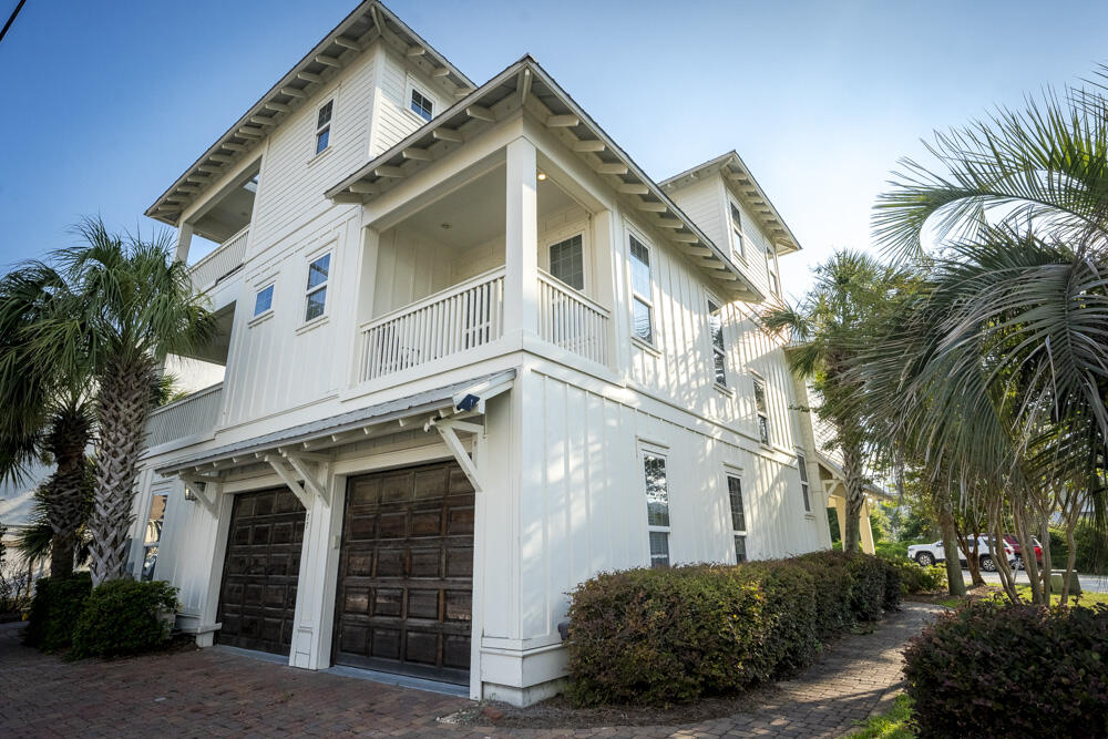 Beach living at it's best.  This costal home offers  beautiful panoramic gulf views with prominent positioning in the heart of Miramar Beach characterize this masterful residence which offers over +3,800 sq ft of living space spanning an impressive four-story vertical footprint which allows for sweeping gulf vistas. This property conveys with a 70'x 60' additional vacant land footprint allowing exceptional room for growth including a potential gulf view carriage house, larger pool, etc. Exceptional investment opportunity through proven vacation rentals.  This five bedroom home, prominently situated just a half block off the gulf with close proximity to Pompano Joes restaurant and beach access. Notable features include a private elevator, 10-11' ceilings with vaulted master bedroom, spacious pool area complete with privacy fencing, two-car garage, covered wrap-around porches with tongue & groove cypress accents, oak hardwood flooring on the second and third floor, durable porcelain tile adorns the first level and wet areas. The open floor-plan accentuates this property's generous proportions & thoughtful design; the first floor features a spacious game/living room all of which is open to the rear pool deck, perfect for entertaining and complete with bunk spaces as well as a full king bedroom suite. The second floor is the epitome of open living with generous proportions including an open kitchen featuring stainless appliances as well as custom cabinetry artfully decorated and professionally designed. The second level also features a suite & ensuite bathroom. The third level offers a large master suite complete with an ensuite bathroom that is outfitted with dual vanities, spacious walk-in shower and private water closet. The third floor also offers additional bedroom suites and a spiral staircase access to the roof-top deck oriented to offer uncompromising sunset views and views over the Gulf of Mexico. Miramar Beach offers world class shopping, restaurants and local entertainment as well as access to the beautiful white sand beaches and emerald green waters of the Gulf of Mexico.