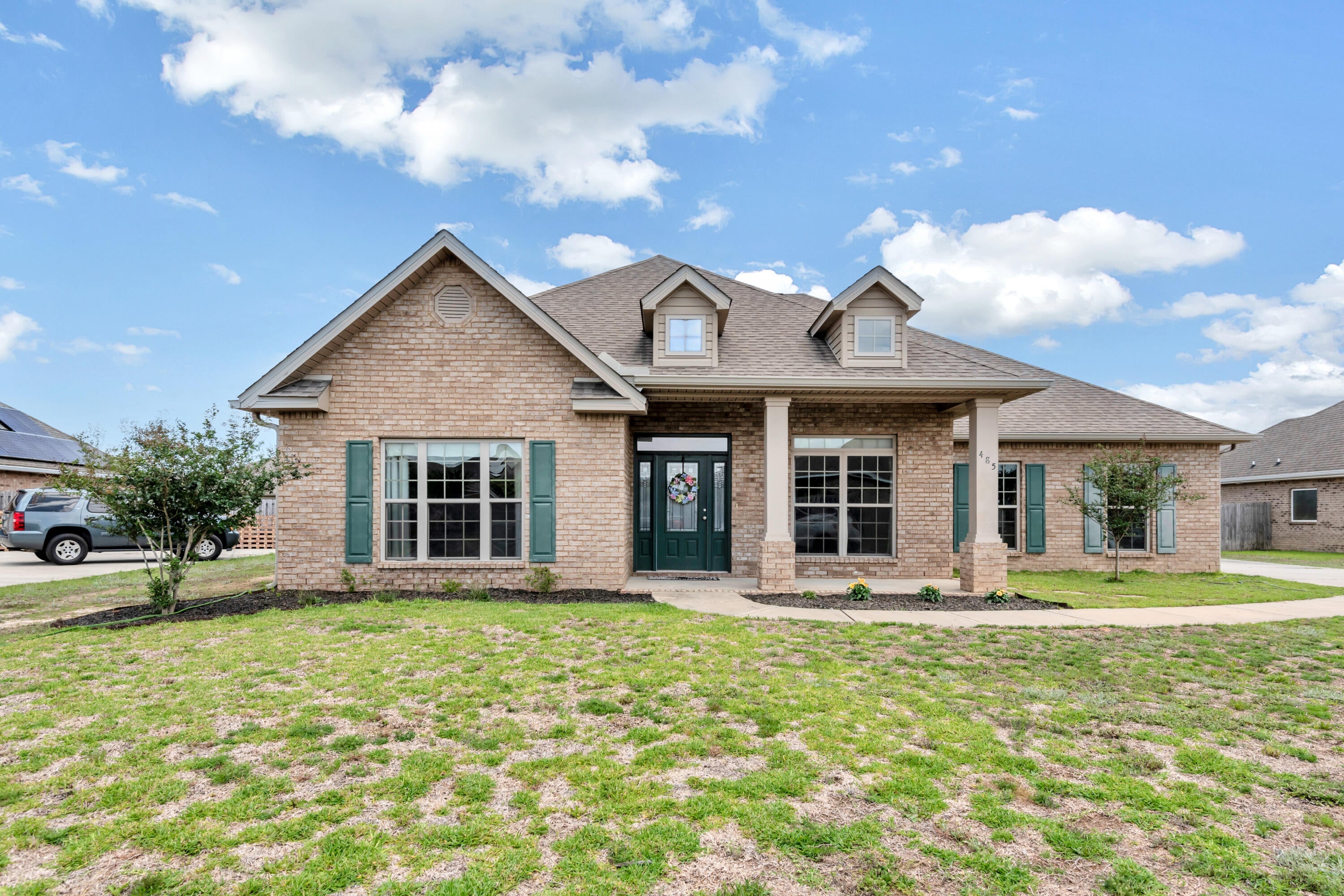Upon entering this One Owner McKenzie home your eyes are immediately drawn down the Grand Foyer to the Great Room featuring a high ceiling with double trey, carpet and large windows opening to the covered patio and fenced back yard beyond. The open floorplan allows the kitchen with a large island as well as large pantry to flow into the Great Room.  The master suite is ideally placed off the Great Room and features a trey ceiling and separate entrance to the covered patio. The Master suite is truly that featuring a large master bathroom with double sinks, separate shower and separate tub. The walkin closet is huge! The front of the home has a large study / library with built in shelves and a sliding door to close it off for privacy. The dining room is large as well. There is a back hall to the kitchen going past the large pantry and laundry room. There are two bedrooms with a full bath off the Grand Foyer and an additional two bedrooms with a full bath located separately off the Great Room. Redstone Commons features a large community pool, children's play area. The community is located near both the elementary school and the middle school. shopping, restaurants, and medical are nearby for convenience and yet a short drive to many of the nearby military bases.