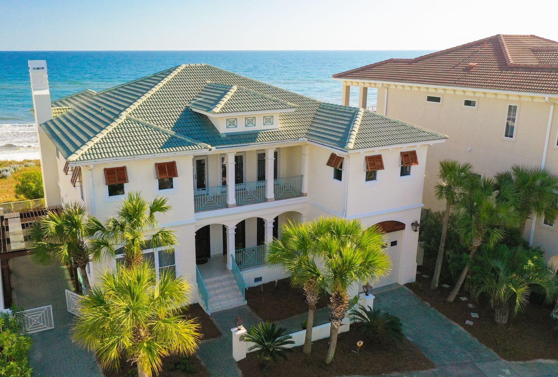 Life doesn't get much better than living on the Gulf of Mexico, and beach homes don't get much better than this stately mansion bordering the pearl white sands and overlooking the emerald green waters. The boardwalk begins at the back deck and ends where your toes meet the sand. Beyond its incredible location, this elegant two-story, five-bedroom, five-and-one-half bath home has been impeccably maintained by the original owners. All new decking, new beach walkover and recent exterior paint ensure a turnkey transaction.
The glorious front door was moved here from a French chateau. The home has surround sound inside, an elevator, attached garage and storm shutters on all the gulf-front windows. Located in a non-rental, gated community directly on the beach, the house embraces a stellar design for comfort, class and convenience. From the open floor plan, gourmet kitchen, tile and hardwood floors to magnificent water views and architectural details throughout, the house radiates fine craftsmanship and luxury beach living. Beautiful bedrooms open to balconies and gulf views. 

Natural daylight floods the living room, dining space, kitchen and breakfast nook. Soft pastels, handsome trim work, pocket doors, transom windows and immaculate landscaping create an aura of peace and tranquility. Spacious covered outdoor spaces are as perfect for grand entertaining as they are for a graceful family refuge and personal haven. This property encompasses nearly three-quarters of an acre and beckons all who appreciate superior workmanship, striking style and distinctive quality in a majestic beachfront setting.