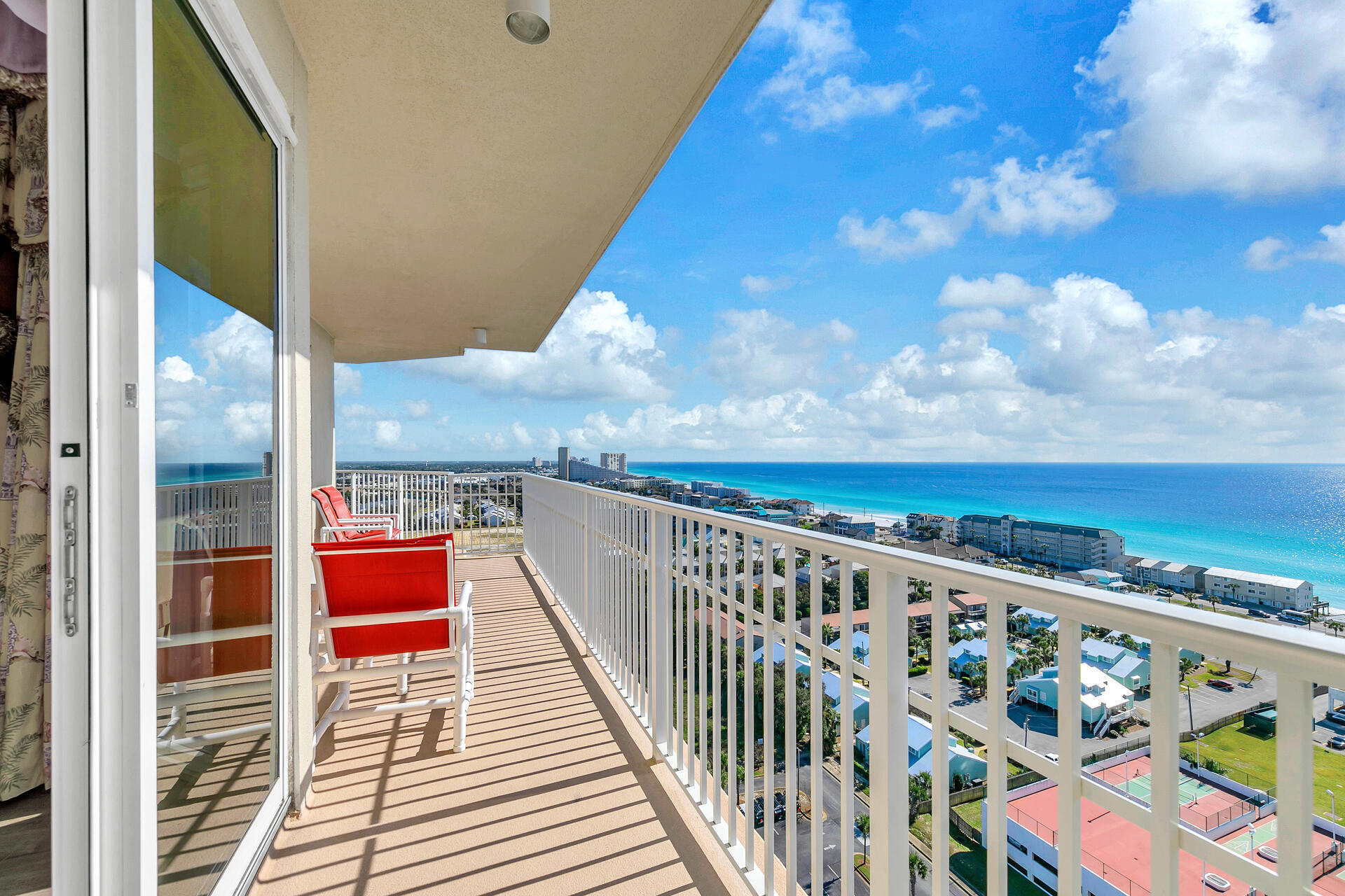 Ariel Dunes Unit 1801 is a luxurious 3-bedroom, 3-bathroom Gulf-view condo in the heart of Miramar Beach, designed for comfort and relaxation. With a spacious layout, this condo can comfortably accommodate, making it perfect for families or groups of friends. 
Step onto the private 18th-floor balcony and take in the sweeping views of the emerald waters and sugar-white sands of the Gulf. This is the perfect spot to enjoy your morning coffee, watch the sunset, or share a meal at the outdoor dining table. Inside, the open-concept living area is furnished with plush seating and, providing a cozy space to unwind after a day at the beach. Ariel Dunes is a premier condo community located within the expansive Seascape Resort. Known for its sweeping Gulf views and top-tier amenities, the property is perfect for families and groups looking for a relaxing yet activity-packed getaway. The resort offers 300 acres of lushly landscaped grounds, featuring walking trails, golf courses, tennis courts, and a variety of pools. Its proximity to Miramar Beach ensures you're just steps away from the emerald waters and powdery white sands that make this region a favorite destination.