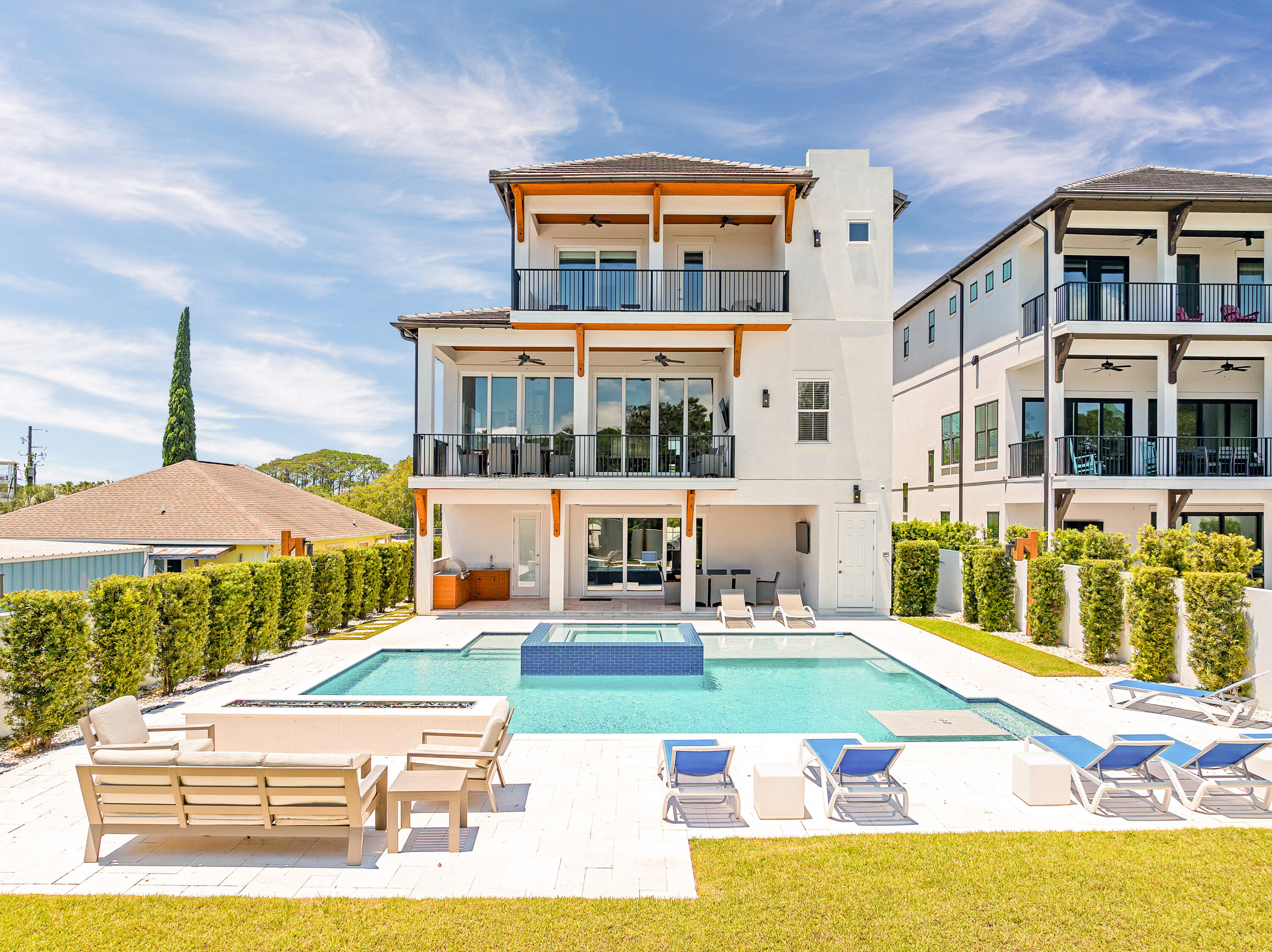 Welcome to your luxurious beach retreat in Blue Mountain Beach! This stunning 9-bedroom home offers the epitome of upscale coastal living, boasting an array of amenities and a prime location just a short stroll from the sparkling shores of the Gulf of Mexico.

Step inside and discover a haven of comfort and style where every detail has been carefully curated. With 12' ceilings, custom hardwood floors, and tile throughout, this home exudes sophistication at every turn.  Entertain with ease in the expansive living spaces, including a top-of-the-line kitchen equipped with all the amenities you need to whip up gourmet meals for family and friends. The open-concept design flows seamlessly into the dining area and living room, creating the perfect setting for memorable gatherings. With master bedrooms and porches on all three floors, this home provides ample space and comfort for guests to retreat and rejuvenate after a day of sun and surf. With an elevator for added convenience, accessibility is never an issue.

For relaxation and recreation, look no further than the abundance of entertainment options this home offers. Host game nights in the spacious game room, watch a movie in the dedicated movie room, or unwind in the resort-style pool and hot tub.  Outdoor enthusiasts will love the outdoor kitchen area and fire pit, ideal for al fresco dining and cozy evenings under the stars. And with no HOA restrictions, you'll be free to enjoy your time to the fullest, whether lounging by the pool or renting out the property for lucrative vacation stays.

Ideally situated just a short walk to the beach, restaurants, and shopping, this turnkey home offers luxury and convenience. Whether you are seeking a vacation getaway or a second home investment, this property will surely exceed your expectations.