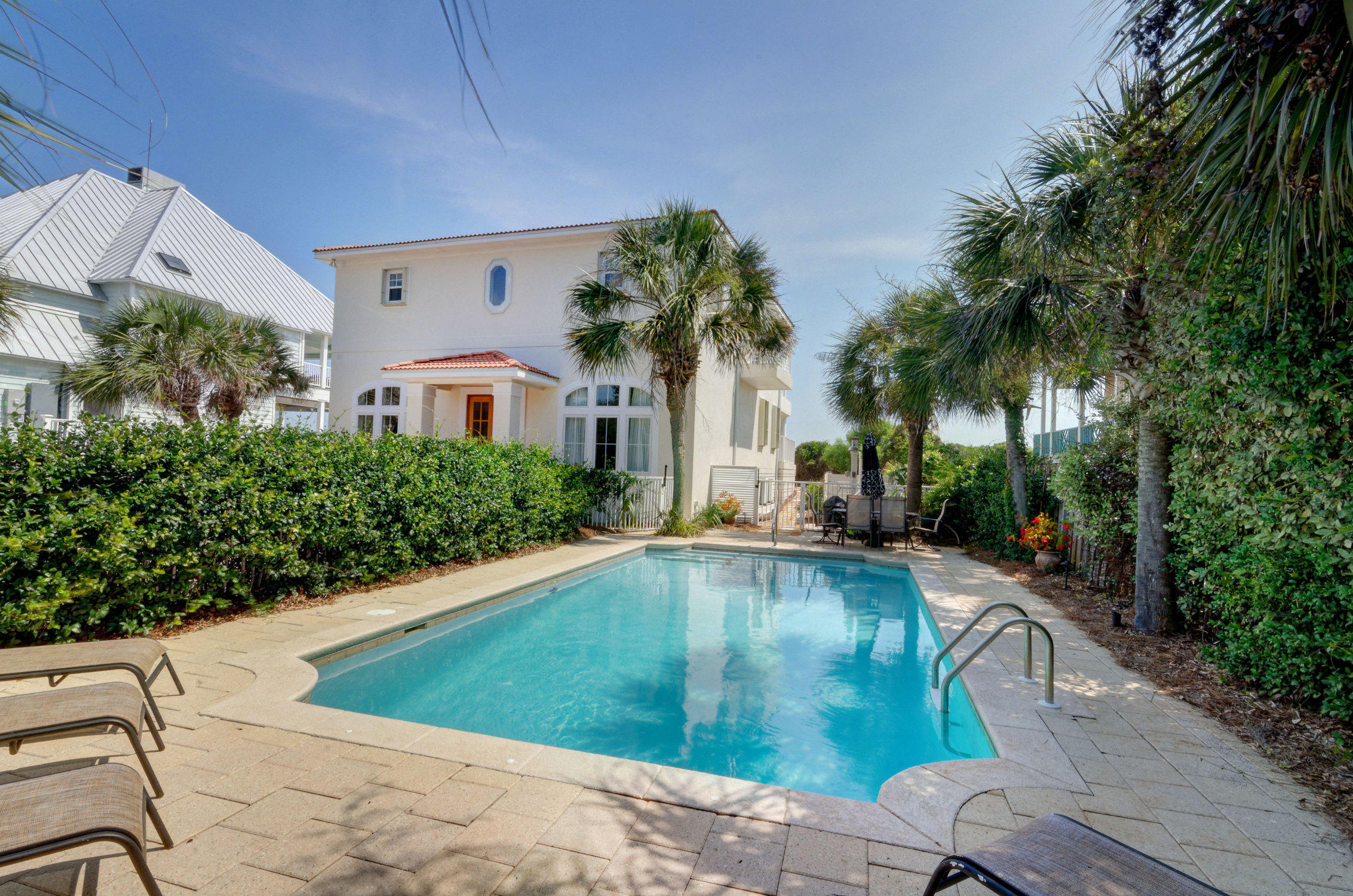 Drastically reduced well below a recent Appraisal! This Gulf Front Pool Home offers stunning Gulf views from the main living area and three Master suites that open onto expansive deep balconies. Recently renovated, this
elevated Beach home is located on a 75 feet of private, pristine beach frontage measuring 395' deep. A seawall was installed to protect the dune. The privacy and abundance of interior and outdoor space combine to make this house the ideal family home or rental investment.
The spacious, open floor plan with warm wood floors, crown molding and gas fireplace on the main level is a perfect compliment to the wall of glass windows that offer mesmerizing Gulf views. The gourmet kitchen with glass door cabinets, stainless steel appliances, two refrigerators, icemaker
and large breakfast bar are convenient to a side porch with grilling area.
This 5 bedroom, 5 1/2 bath home is truly spectacular with its expansive covered balconies, private beach walkover, outdoor grilling area, shower and a 15' x 30' backyard heated pool surrounded by ample patio space and lush landscaping. There is even room to add a Carriage house over a garage! One of the three Master suites  features a gas fireplace. Two additional large  bedrooms and  baths are located on the first floor. You can live your life in the luxury of your own secluded paradise. 
Recent renovations include a new roof, new exterior stucco, balconies, new baths, new flooring and front door and interior paint. All three AC units have been replaced in last 1 to 3 years..

This 30A treasure is ideally located to the miles of jogging and biking trails, a short drive from the Santa Rosa Beach Golf Course, Sandestin and Seaside and just a short walk  from the quaint town center of Gulf Place with dining, eclectic shops, tennis and outdoor amphitheater.