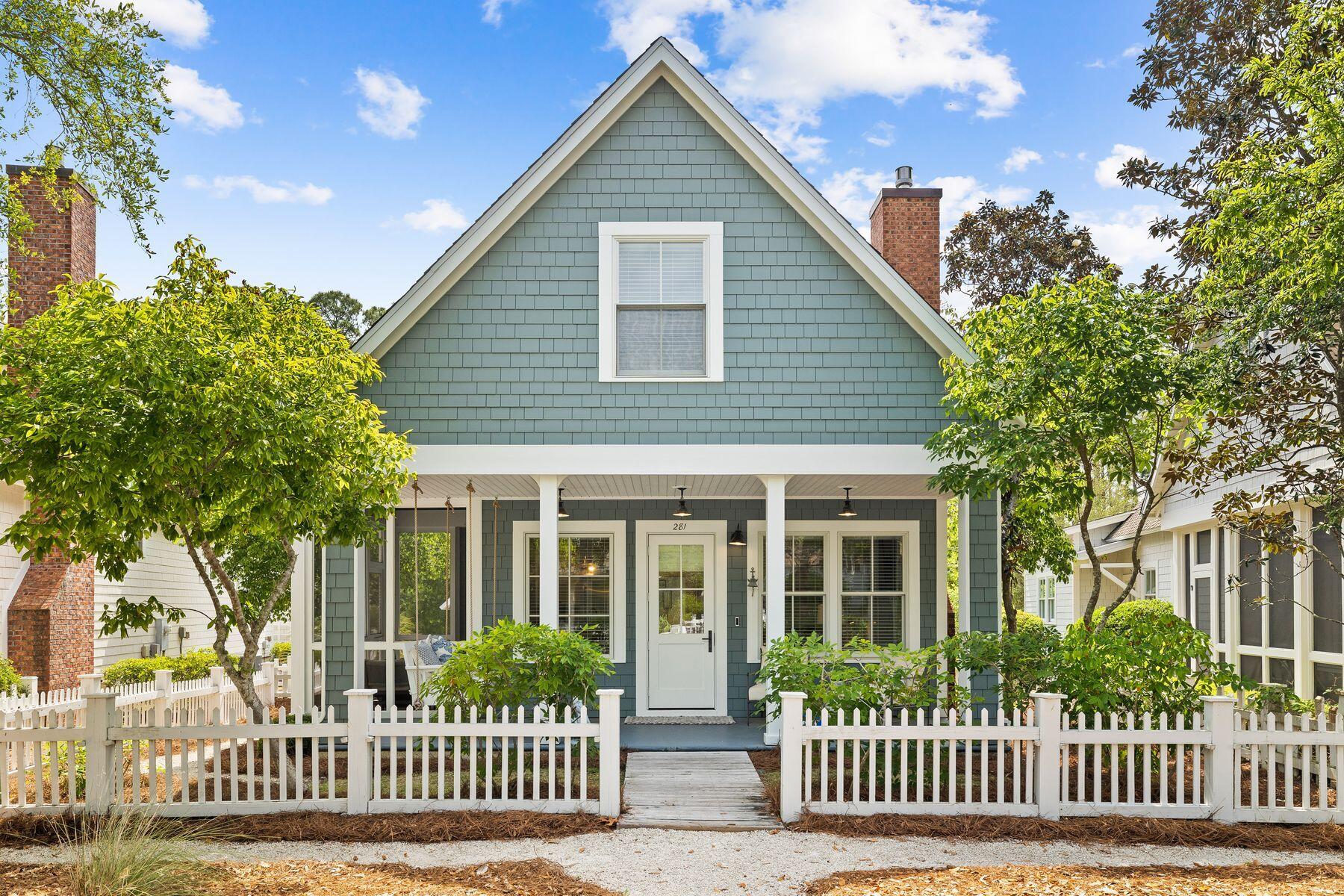 Set behind a white picket fence, this coveted Nantucket-style beach cottage is currently the lowest-priced home in WaterSound Beach. Close to extensive amenities and the private beach that WaterSound is known for, this charming home conveys with high-end furniture, a golf cart, and kayaks. Sitting on a generous lot, there's a detached garage and ample space to add a private pool. The front porch is perfect for relaxing or reading on the custom porch swing. Step inside to find a cozy sitting room with new hardwood flooring, soaring ceilings and white wainscoting surrounding a cozy brick fireplace. Multiple windows showcase pretty garden views. The dining area flows directly into the kitchen with a breakfast bar providing additional seating when entertaining. The well-appointed kitchen has a new refrigerator, range, dishwasher, and a wine/beverage refrigerator for serving perfectly chilled drinks. A laundry and office area with built-in cabinets maximize the additional space. Alfresco dining can be enjoyed on the adjoining screened porch or beneath the arbor on the side deck. This pristine home boasts multiple updates and repairs, totaling more than $100,000. These include a new tankless water heater, replacement HVAC with a programmable thermostat, monitored fire/smoke detectors, and Ring doorbells for security. Quartz countertops have been added to the kitchen and bathrooms, with new faucets and paint. The former water heater closet has been converted into a useful pantry with a lock-off. This cute-as-a-button cottage has a spacious primary suite with an ensuite bathroom on the first floor. Stairs lead up to two guest bedrooms tucked beneath the eaves. As well as the one-car garage, this newly painted home has multiple storage closets making it ideal as a second home or vacation rental in this sought-after community. Onsite amenities include a mile of beach, boardwalks, community pools,  The Dunesider Grill, and a fitness center. The stunning white sandy beach and emerald gulf waters are just a short stroll from the door.