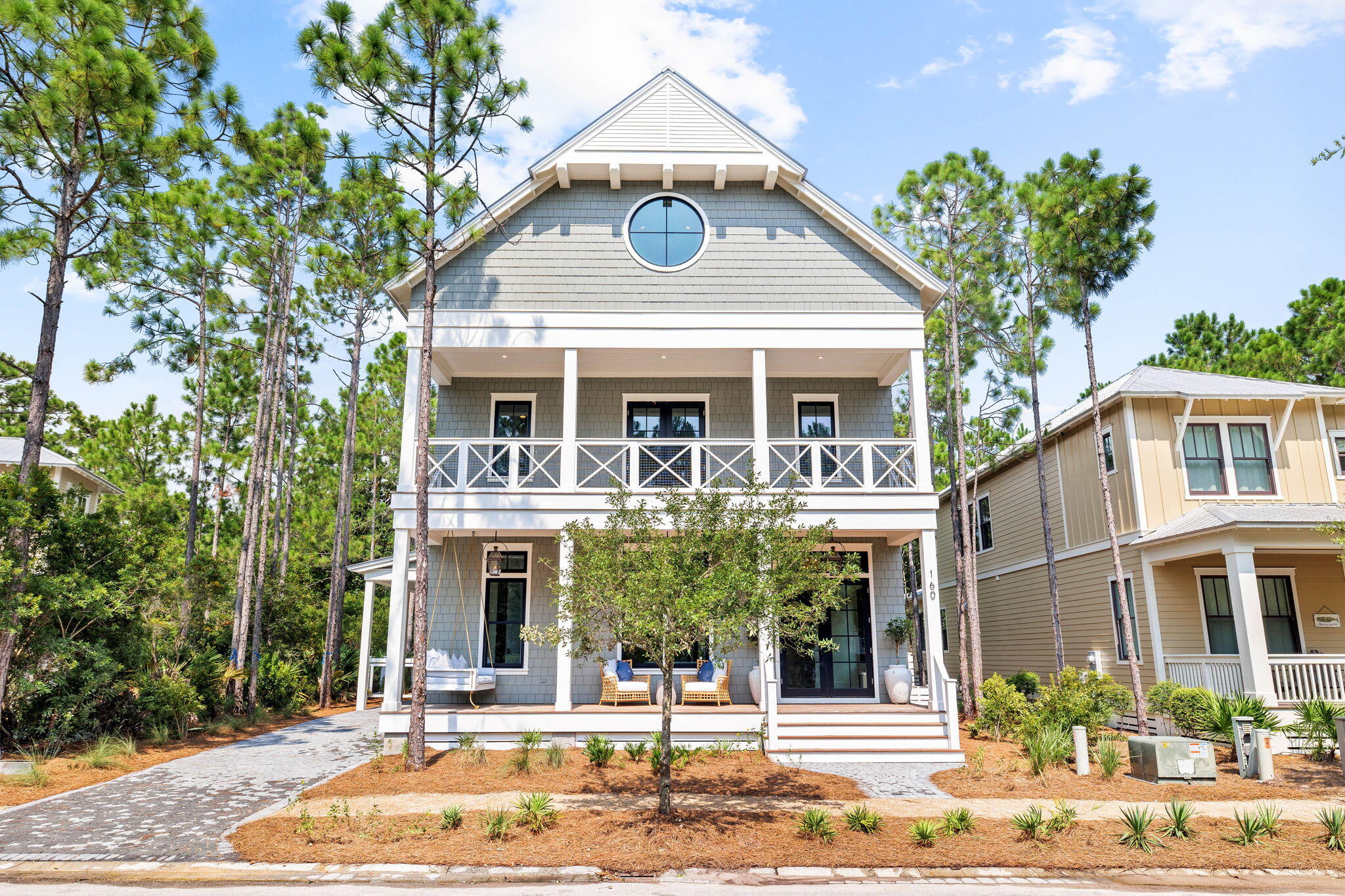 Framed by picturesque vegetation and prominently positioned within the Forest District of Watercolor, this impressive new construction opportunity, aptly coined Maison De Blue, embodies the epitome of luxury coastal living along 30A. 

Executed by the renowned Coastal Elements building team and the skilled design team at Q Interior Surfaces, this inimitable architectural masterpiece spans three levels with over 5,100 square feet of articulated living space. 

Upon initial approach, the spacious porch leads the way to the vaulted foyer with  French oak flooring carried throughout. Adorned with Venetian plaster and white oak beams, the stately living and dining areas open up to the Chef's kitchen boasting custom cabinetry, custom tile and lighting along with a professional appliance suite, and an oversized island. The adjoining scullery with full length cabinetry incorporates additional storage, countertop space with a sink, and a dishwasher. Effectively blurring the line between indoors and out, the screened in porch that abuts to the living room is the perfect place to enjoy the coastal breeze and stay cozy in winter months sitting by the fire and enjoying the warmth of the top-of-the-line Infratech flush mounted heater which turns the space into a true four season room for year round entertainment and enjoyment.

Synonymous with tranquility and relaxation, the backyard oasis is centered around the private pool and spa with cascading water feature flowing down custom tiled wall.  Designed with entertaining in mind, the covered outdoor kitchen and grilling station overlooks the pool and outdoor fire pit. A bedroom with ensuite, powder room, wine cellar, and dedicated pool laundry suite are also found on the first floor.

Situated on a private wing, the main suite encompasses sleeping quarters, a walk-in wardrobe, and a posh ensuite with soaking tub, double vanities, and a custom mosaic floor with bespoke lighting and grasscloth wall covering. Three additional bedroom suites, a study, and laundry area complete the second level.

Reigning over half of the third level, the bunk room is sure to impress and foster fun for all ages with ping pong table,  and TV area, and drybar in addition to the custom built-in bunks. A full bathroom and a space perfectly configured for a home theatre or home-gym completes the uppermost level.

WaterColor affords residents with a culmination of amenities including a beach club, fitness center, town center, tennis and pickle ball courts, and ample walking and biking trails as well as boathouse and lake to paddle board or kayak while remaining geographically poised minutes from all the world-class dining and entertainment venues 30A has to offer. Inquire today to schedule a private viewing and start envisioning the coastal lifestyle you deserve.