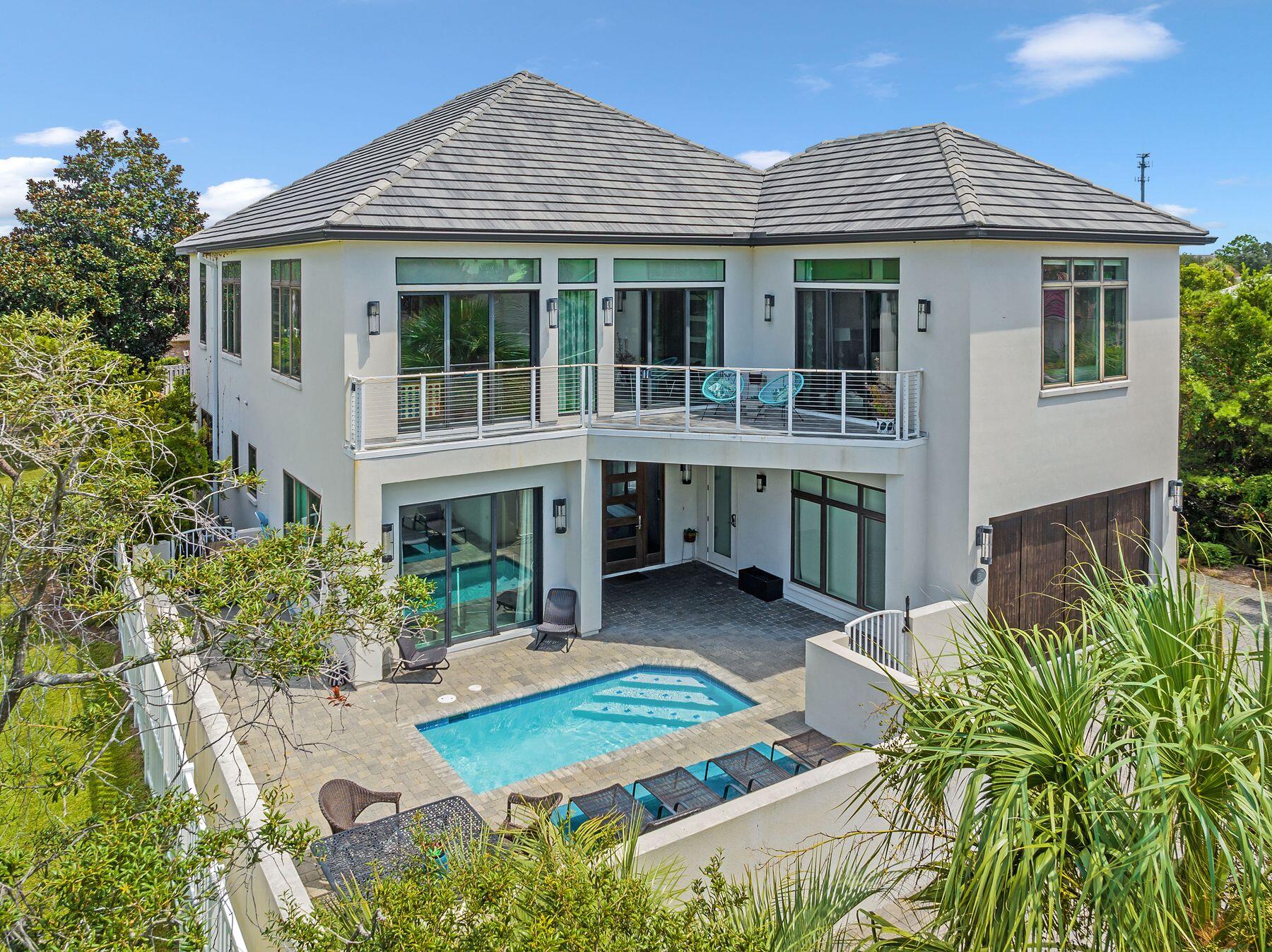Welcome to 119 Avalon Blvd! This perfectly positioned 6 bedroom, 6 bath home boasts beautiful views of the Gulf Coast's emerald waters. Thoughtfully constructed to maximize livability, each step through this property will continue to impress. 
Contemporary in design, this 4000 sq ft iconic residence features a professionally decorated interior, spacious pool deck, attached cabana room complete with full wet bar, and a custom bunk room. 
Not to be outdone, the open concept 2nd level captivates with straight forward views showcasing crystal clear waters from both the living room and master bedroom. 
Avalon Beach Estates sets itself apart with  its exclusive private beach. Dedicated to just residents and guests, beachgoers can  take full advantage of the sugary white sand! Come visit!