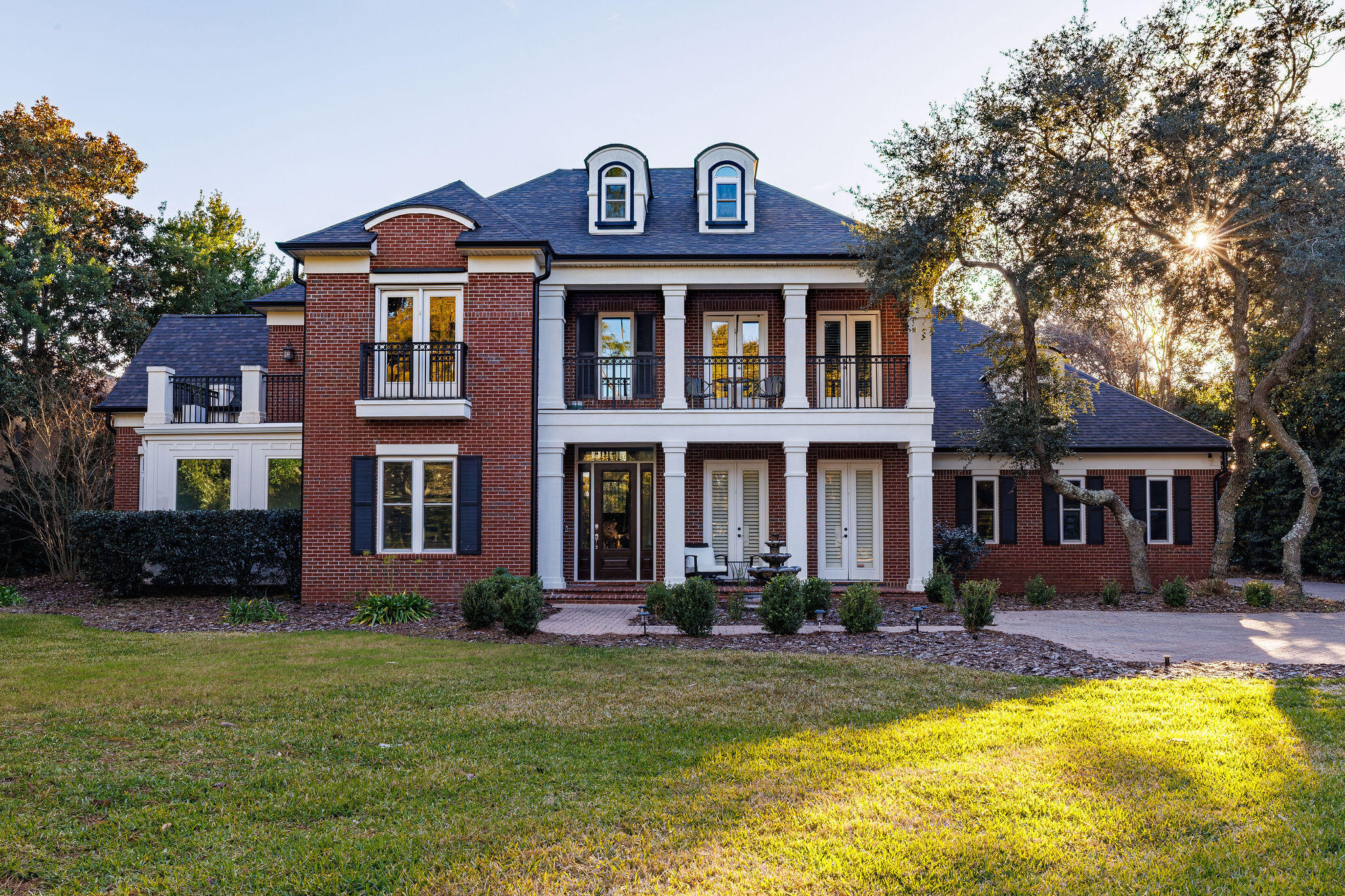 This refined coastal residence offers a sophisticated indoor-outdoor living experience on an exceptional .65-acre corner lot in Kelly Plantation--one of the Emerald Coast's premier gated golf communities. Crafted by acclaimed builder Bob Fisher and designed with a Southern Living floor plan, the home balances architectural charm with thoughtful modern upgrades and enduring quality.

The resort-style backyard is a private sanctuary complete with a rock waterfall pool, heated spa, fountain, fire pit, citrus trees, and multiple brick terraces for gathering and dining. A pool safety gate and a children's play set add versatility for families, while mature landscaping ensures privacy and year-round beauty. Inside, soaring ceilings, hardwood floors, and abundant natural light create a warm and inviting atmosphere across generous living and entertaining spaces. Recent enhancements include a 2023 roof, impact windows, three HVAC units within the last five years, two newer water heaters, new interior and exterior paint with sealing, new guest room carpet, sun room, office and a whole-house gutter system delivering peace of mind and efficiency for years to come.

Kelly Plantation provides 24/7 gated security, championship golf, a fitness center, tennis, parks, trails, and an on-site restaurant all moments from the beaches via car or golf cart to marinas, shopping, and dining that define luxury living along the Emerald Coast.