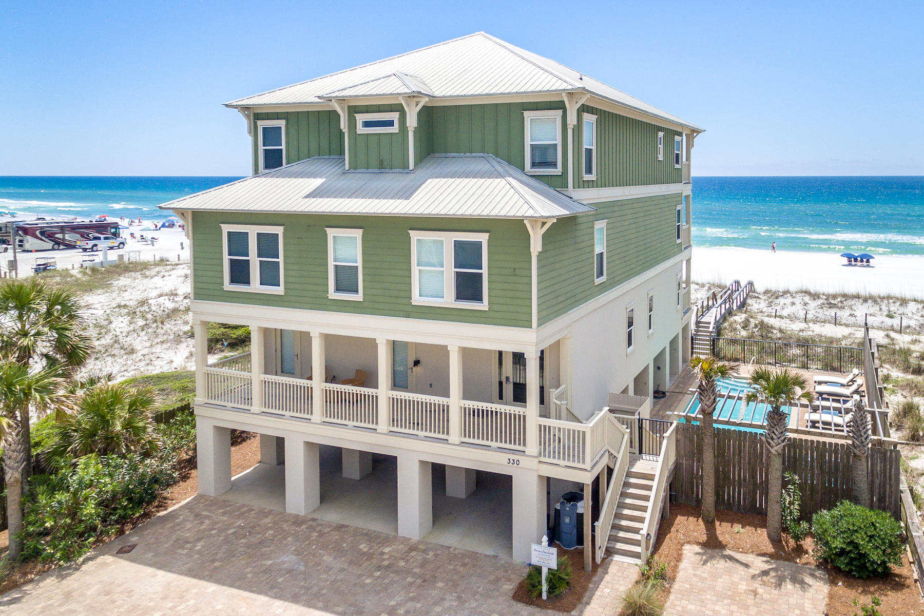 Sophistication, seclusion, and high rental income in this newly renovated, professionally designed Gulf-front retreat located in one of Miramar Beach's best-kept secrets, Tang-O-Mar. This quiet enclave offers the stillness of Old Florida but within close proximity to Sandestin, Destin, and 30A. Designed by Duce & Co, extensive renovations were completed in March of 2018. Rental income is projected to top $300K! No mandatory HOA dues. This 5,700 sq. ft. luxury home features two full kitchens, stylish interiors, a private elevator, and large gathering spaces. The courtyard with full-sized pool, spa, covered patio, and game center rests oasis-like alongside the white sands and emerald waters of the Gulf. Neutral interiors punctuated with glamorous light fixtures and ink-colored accents make the rooms feel sleek and chic, while highlighting the natural beauty outside. Each floor offers a gathering space and a terrace. Both the first and third floors feature full size kitchens. The main kitchen on the ground floor is expertly designed for both form and function; features all new appliances; and offers seamless movement into the living area and formal dining room. The master suite, occupying the rear of the third floor, is the ultimate in beachfront opulence. Superior appointments include a private terrace, sitting area, private laundry, and immediate access to the third floor kitchen. Featuring a luxurious Roman soaking tub arranged just below a large window commanding the Gulf, dual-headed marble shower, two water closets, and designer finishes, the redesigned en suite is luxurious retreat.