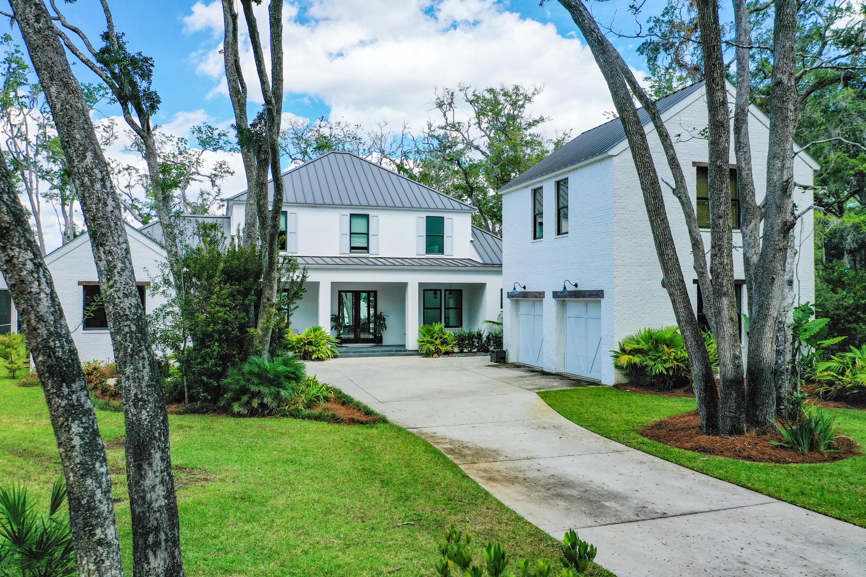 Bay-front living at it's best with this beautifully constructed home in Point Washington. The Woods neighborhood offers a peaceful escape with world class boating all just minutes from the beaches that have made 30A famous.  Seaside, Grayton Beach and Seagrove beaches are just a few minutes from the house.  

Entering the home you are greeted with expansive bay views through the open living area. The spacious kitchen with quartzite countertops and a Wolf gas range leads to a screened in porch with an outdoor grill and sink and pool area. White oak floors can be found throughout the home. There is a newly installed dock with a 12,000 lbs boat lift and 2 Jet Ski lifts for easy access to the bay.
