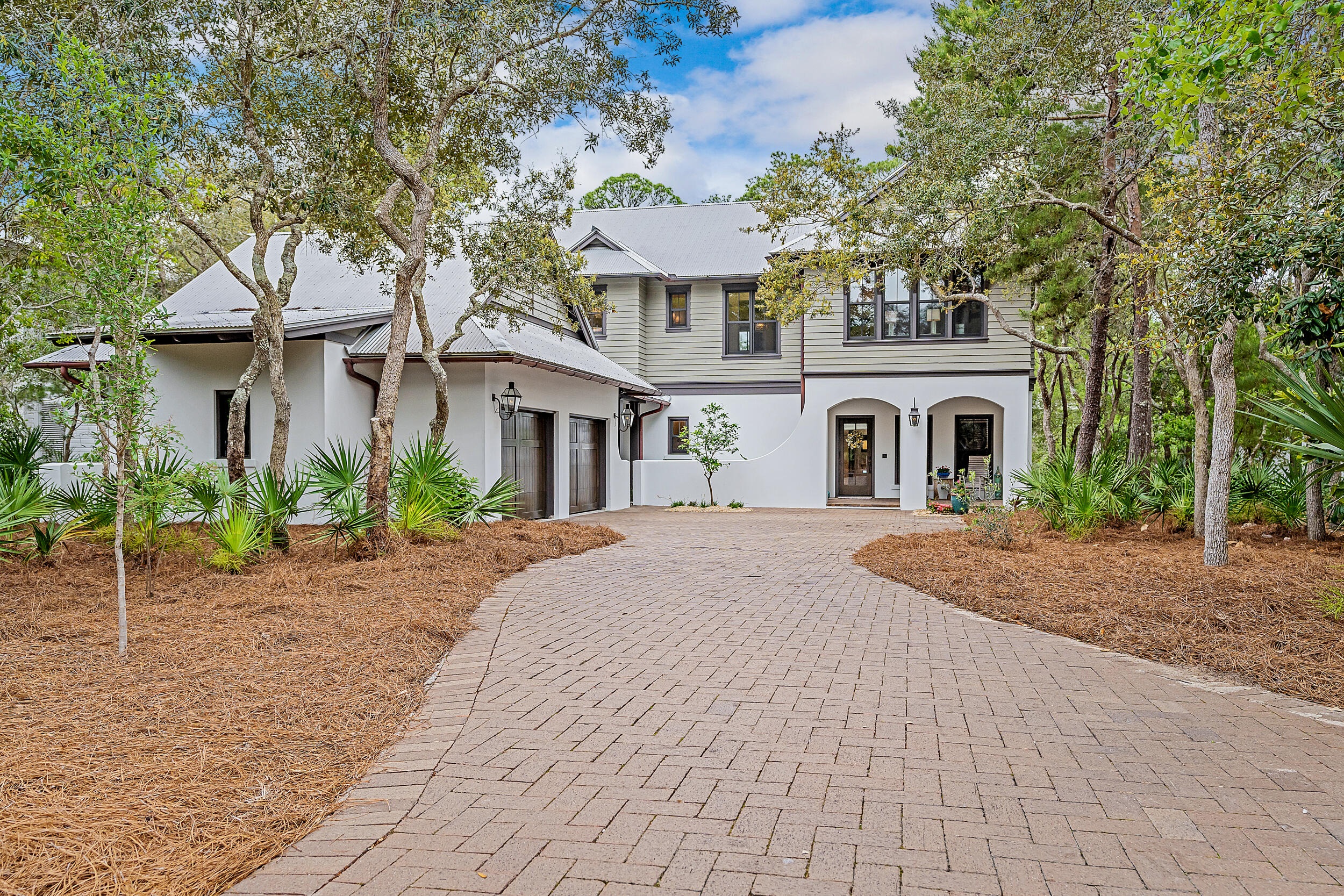Property under contract with a 72-hour kick out clause. At the very height of luxury sits Lake Place at Grayton Beach, an exclusive rental restricted, gated neighborhood south of 30A in the paradisiacal Grayton Beach community. Privacy is abundant with lush natural vegetation sprawling over a third of an acre, leading out to your private dock with over 80ft of water frontage along Western Lake, a rare coastal dune lake on 30A spanning approximately 200 acres stretching all the way from Grayton Beach to Watercolor. Come embrace the 30A lifestyle, whether you are fishing off your dock, boating to the beach or kayaking and paddle boarding in to the sunset, you will soon understand the uniqueness of life on a coastal dune lake. Sighs of contentment will replace stressful worries once you step foot into this like new home that has been refreshed from top to bottom. Professionally decorated and furnished with furnishings conveying. An entertainer's delight, this home was designed to flow seamlessly from indoors to outdoors. The main floor features a custom chef's kitchen and butler's pantry leading to the formal living and dining room out to the enclosed screened in porch, all overlooking Western Lake. The first floor entertaining area has a dry bar and a kitchenette with a second living and dining area that walk out to a covered patio leading to the private spa pool. An optimal floor plan, the primary suite is off the main living area with a separate office or home gym. The guest suites are all private from one another and are accessible off the second living area. The oversized two car garage has plenty of storage and a climate controlled attic. Lake Place at Grayton also offers a community pool and dock as well.  You don't want to miss this masterpiece of an estate!