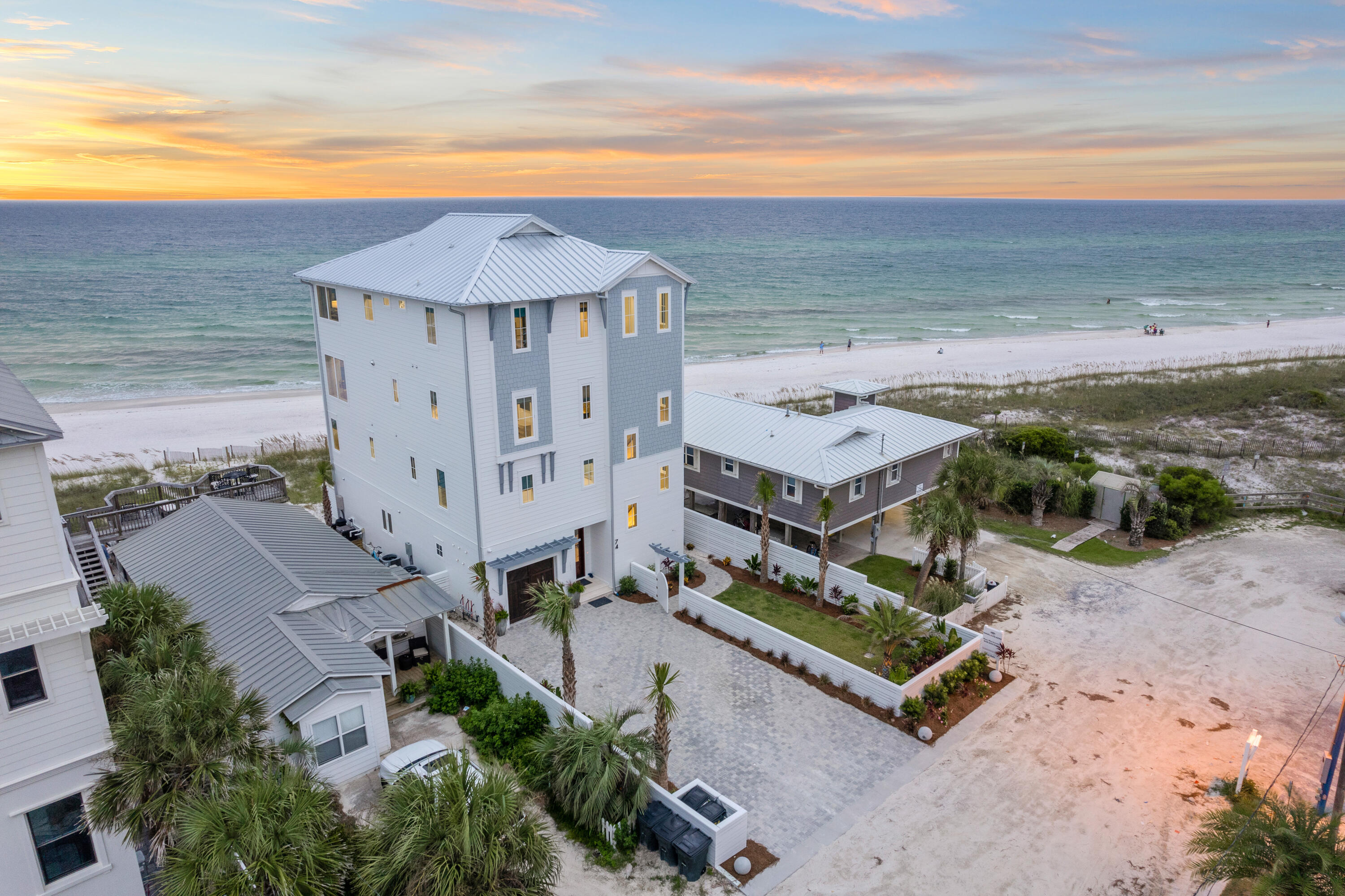 BRAND NEW Gulfront masterpiece you don't want to miss! 74 S Emerald Cove is beach living at its finest. 49 feet of private deeded beach access located in the exclusive area of Inlet Beach.This four story luxury home was custom built  with every inch thoughtfully designed to maximize the indoor and outdoor living experience. Fully equipped residence with floor to ceiling windows and private decks on every level.
 This beach home has it all; two large gourmet kitchens, beautiful quartz countertops, custom cabinetry, professional sound systems on multiple levels of the home, security system, designer decor and luxury fixtures.