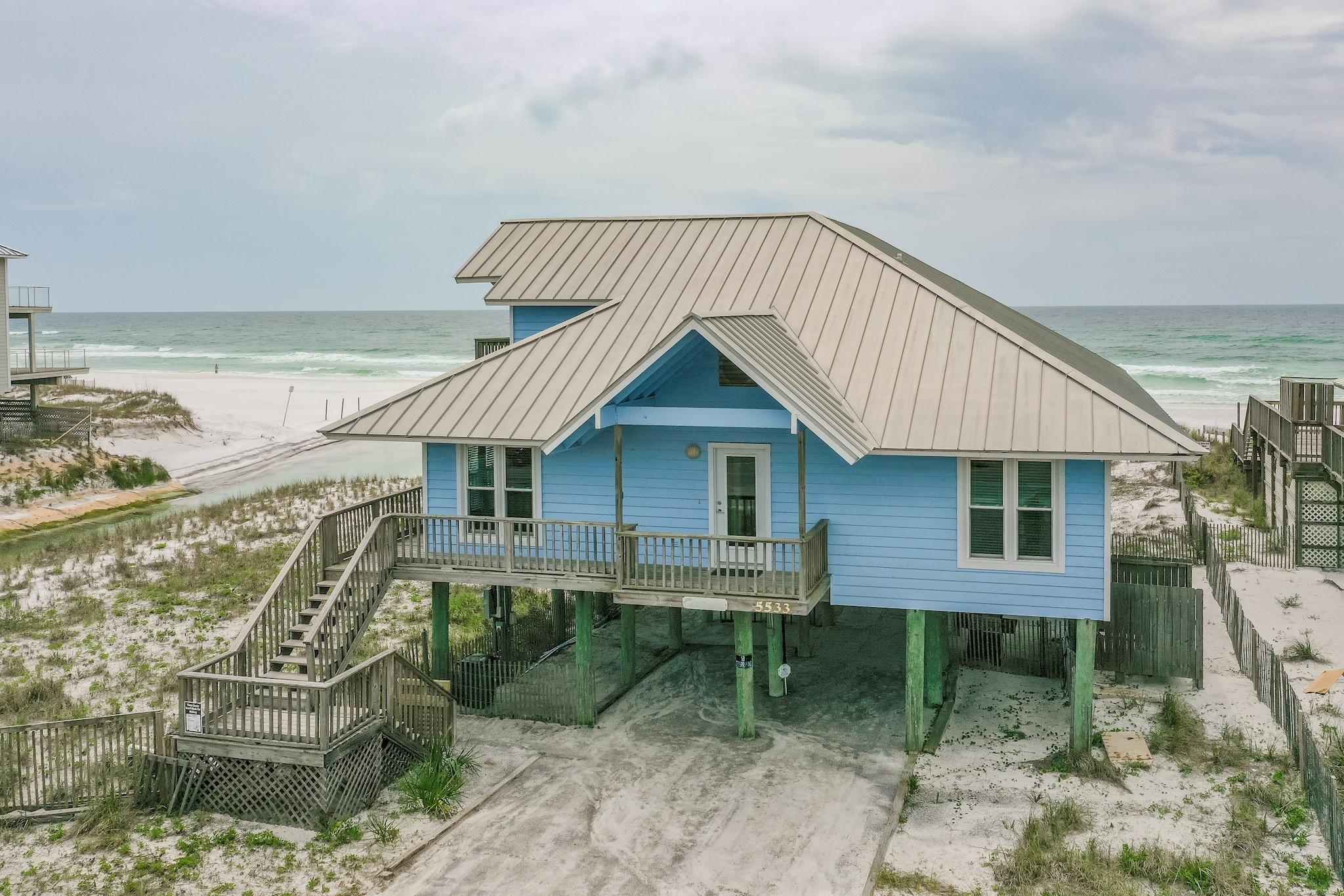 GULF FRONT on 30A with incredible, wide-open views!  ''Lagniappe'' is located in Dune Allen on a large lot, directly on the Gulf of Mexico, with 140+ feet of private beach. Enjoy the gulf breeze and views from the 10'x40' porch across the back of the home. The open floorplan, living, dining, and kitchen span 40 feet, offering beautiful views from the inside or outside. There are four bedrooms, all on the main level, each with an en-suite bath and king-size bed. The large bonus room upstairs has two trundle beds and a pullout sleeper sofa, along with a deck overlooking the Gulf. Upgrades include stainless steel appliances, granite countertops, and tile floors in the kitchen.  Excellent rental history! Sold furnished with the exclusion of some personal items. All information to be verified Additional pictures coming soon.