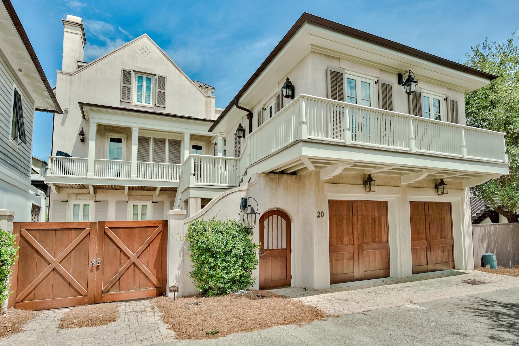Welcome to 20 N Spanish Town Lane, a magnificent coastal estate located in the heart of Rosemary Beach. Enjoy breathtaking Gulf views from this stunning property that is just steps away from both the beach and the center of Rosemary Beach. Situated on boardwalk H, this prime location is perfect for those seeking the ultimate in relaxation and recreation.

Built to a high standard, this custom all masonry block home with a copper roof is a true architectural masterpiece. The home is filled with unique details, ranging from pecky cypress ceiling inlays to brick and coastal wood flooring. The main house features three floors plus a finished basement, and the carriage house is connected via a 2nd-floor bridge walkway.

This Rosemary Beach gem features a dramatic pool with a fountain backdrop and outdoor fireplace, offering the perfect setting for outdoor entertaining. With ample parking for up to four vehicles, this property has several unique features not available in many homes in the area, including a finished basement with a wine cellar, office, and game room, a third-floor roof terrace with Gulf views, and a heated pool/hot tub.

The interior of this home is just as stunning as the exterior, with the finest materials used in construction, including a copper roof, oversized moldings, hidden half bath and liquor cabinet, Ipe balconies, marble in the bathrooms, Bevolo exterior lighting, Water Works fixtures, custom cabinetry, Tischler windows from Germany, and incredible craftsmanship throughout. The chef's kitchen is fully equipped with high-quality appliances, including Sub-Zero refrigerators, two ice makers, two wine refrigerators, two ovens with six gas burners, warming drawer, DCS grill, and a filtered water system.

The stately architectural style of the property is designed to allow for cool, Gulf breezes to flow seamlessly inside, making it perfect for the many beautiful Spring and Fall days in the Florida Panhandle. With its coastal elegance and comfortable, warm interiors, this property is a perfect primary home, second home, or rental property.