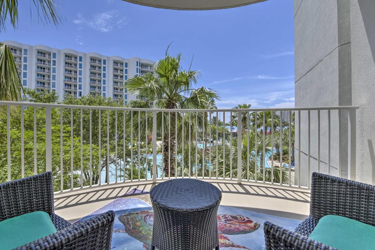 Resort Views & Poolside Living: Your Turnkey Emerald Coast Oasis. Experience the ultimate Destin, Florida lifestyle in this beautifully furnished junior two-bedroom two-bathroom retreat. Perched on the third floor, this residence offers a rare mix of pool-side views and palm tree privacy that makes your balcony the perfect front-row seat for Destin's largest lagoon pool. Inside, an effortless open-concept layout flows directly to your oversized outdoor living space. But the real magic lies just outside your door. The resort's lagoon-style pool—complete with waterfalls, kiddie pool, a splash pad, and hot tub—plus on-site dining, a coffee shop, and courts for tennis, basketball, and the ever-popular pickleball. And don't forget the playground, indoor fitness center, outdoor grilling area, and electric vehicle charging stations. Just a 10 minute walk or a complimentary seasonal shuttle ride to June White Decker Beach Access, The Palms of Destin is also centrally located in Destin with convenient travel to local airports, world-class golfing and fishing, shopping centers, waterparks, restaurants, and tourist attractions.  
The Condo Owner's Association dues cover water, cable, wifi, trash, and even electricity! Call today to schedule a private showing! Buyer to verify all information.