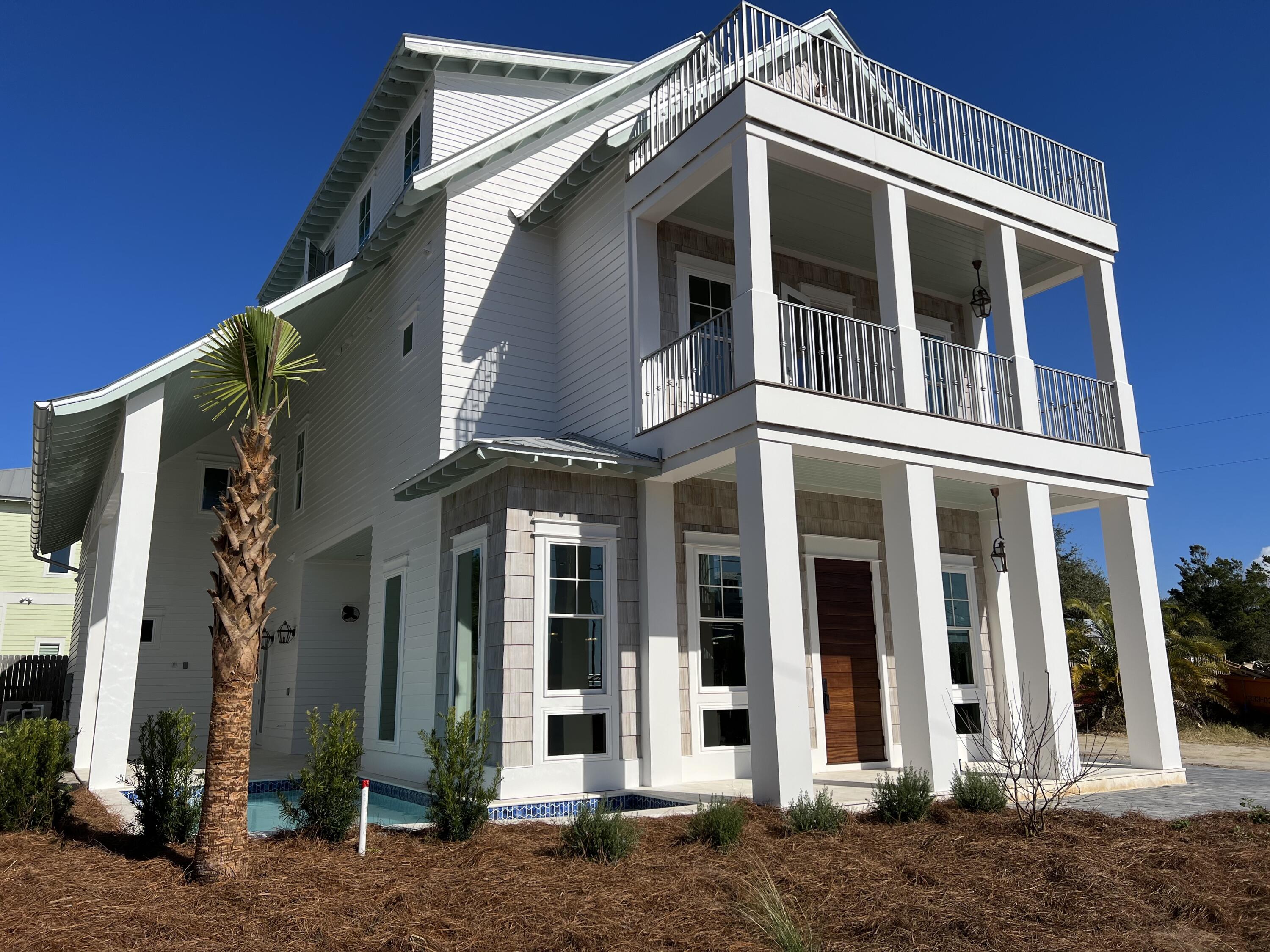 One block West of the E. Lake beach access, this home embodies the charm of old Florida complimented by state-of-the-art amenities. Views of the Gulf are captured from all porches. Multiple living areas, bonus room, private pool and large outdoor entertaining area provide every amenity to make this your primary residence or luxury vacation paradise. 7 BR / 5.5 BA, 1.5 car garage, ample additional parking, open concept chef's kitchen, and private pool with outdoor kitchen and entertainment area.

Expansive living area for the adults and second game/living room for the kids. Second story master, bunk room and guest suites.  Sweeping views of the Gulf from multiple porches! Don't miss the secret room!