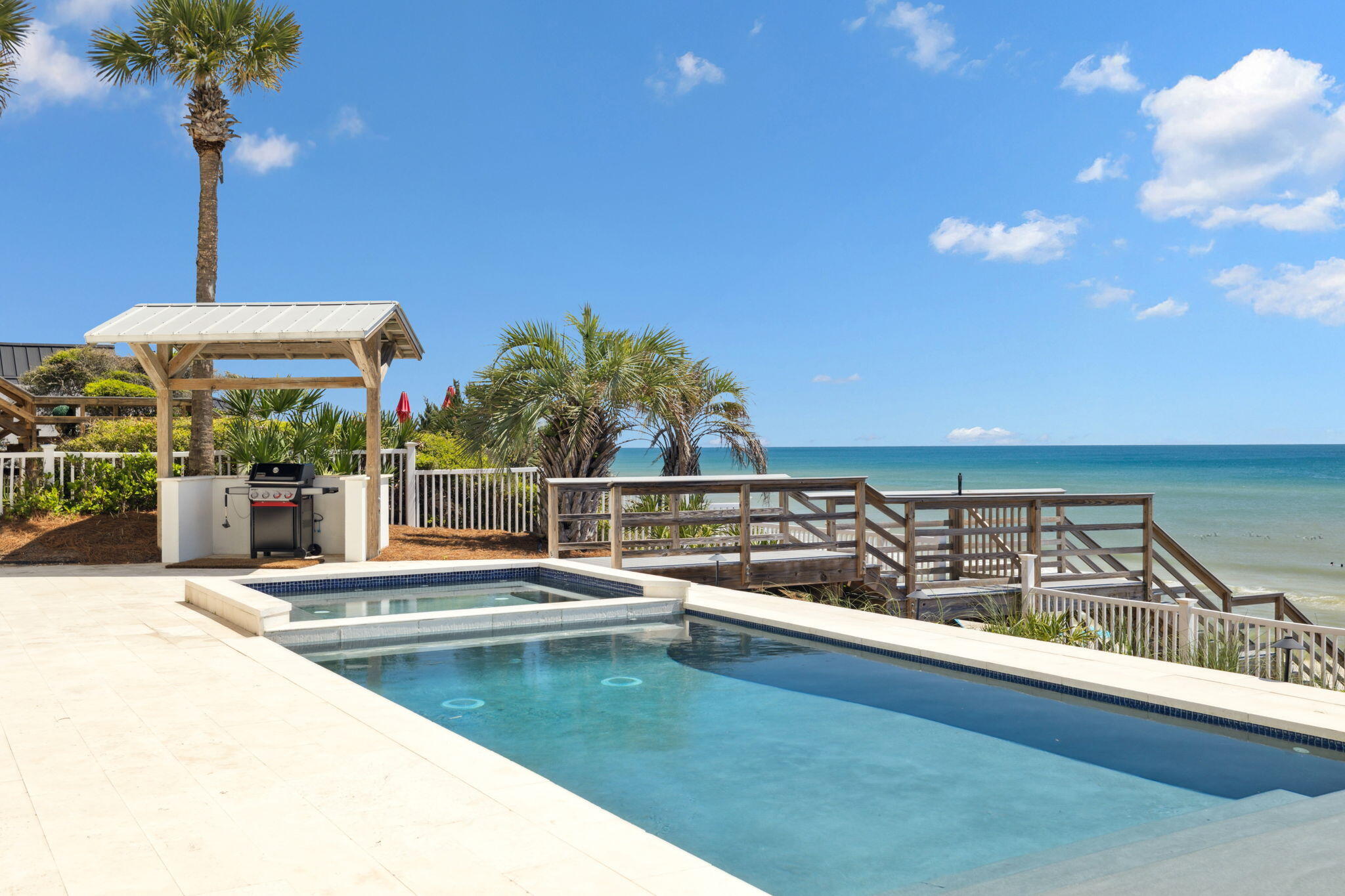 Perched along one of the most exclusive stretches of Scenic Highway 30A, 8266 E Co Hwy 30A is a masterfully curated Gulf-front estate offering 80 feet of pristine beach frontage and nearly half an acre of seclusion on the coveted east end. A rare legacy offering, this impeccably appointed residence marries timeless coastal design with the serene cadence of the Emerald Coast.

With panoramic Gulf views from nearly every vantage point and a proven track record of strong rental income —  over $729K in peak year performance — this property offers a compelling blend of investment and lifestyle. Designed for elevated entertaining and effortless relaxation, the first floor welcomes with a bespoke entertainment lounge, complete with arcade games, billiards, and a plush cinema-style seating area. Two luxurious guest suites, a fully stocked kitchenette featuring a Miele coffee station, and direct access to the private pool and spa create a five-star guest experience.

Ascend via the brand-new elevator to the second level, where an expansive open-concept layout unfolds. A culinary dream kitchen features Wolf, Viking, and Miele appliances, while the dining and living areas offer unobstructed views of the Gulf's turquoise waters. Three guest suites, including two with direct balcony access and a charming bunk room, ensure all guests are accommodated with grace and comfort.

The third level is reserved for the grand Primary Suite, a true sanctuary. Wake up to sweeping Gulf views, unwind in the private sitting area, or soak in the tranquility of a spa-inspired bath complete with oversized soaking tub and glass-enclosed shower. A private balcony offers a front-row seat to every sunset.

Outside, the private Gulf-front pool and spa, full summer kitchen, and expansive patio invite you to live life outdoors. Professionally designed interiors, fresh accessories, and premium finishes throughout speak to the caliber of this exceptional estate.

Whether you're looking for the ultimate family compound or a high-performing luxury rental, 8266 E Co Hwy 30A delivers on every level  a rare coastal jewel offering both exclusivity and soul-soothing serenity.